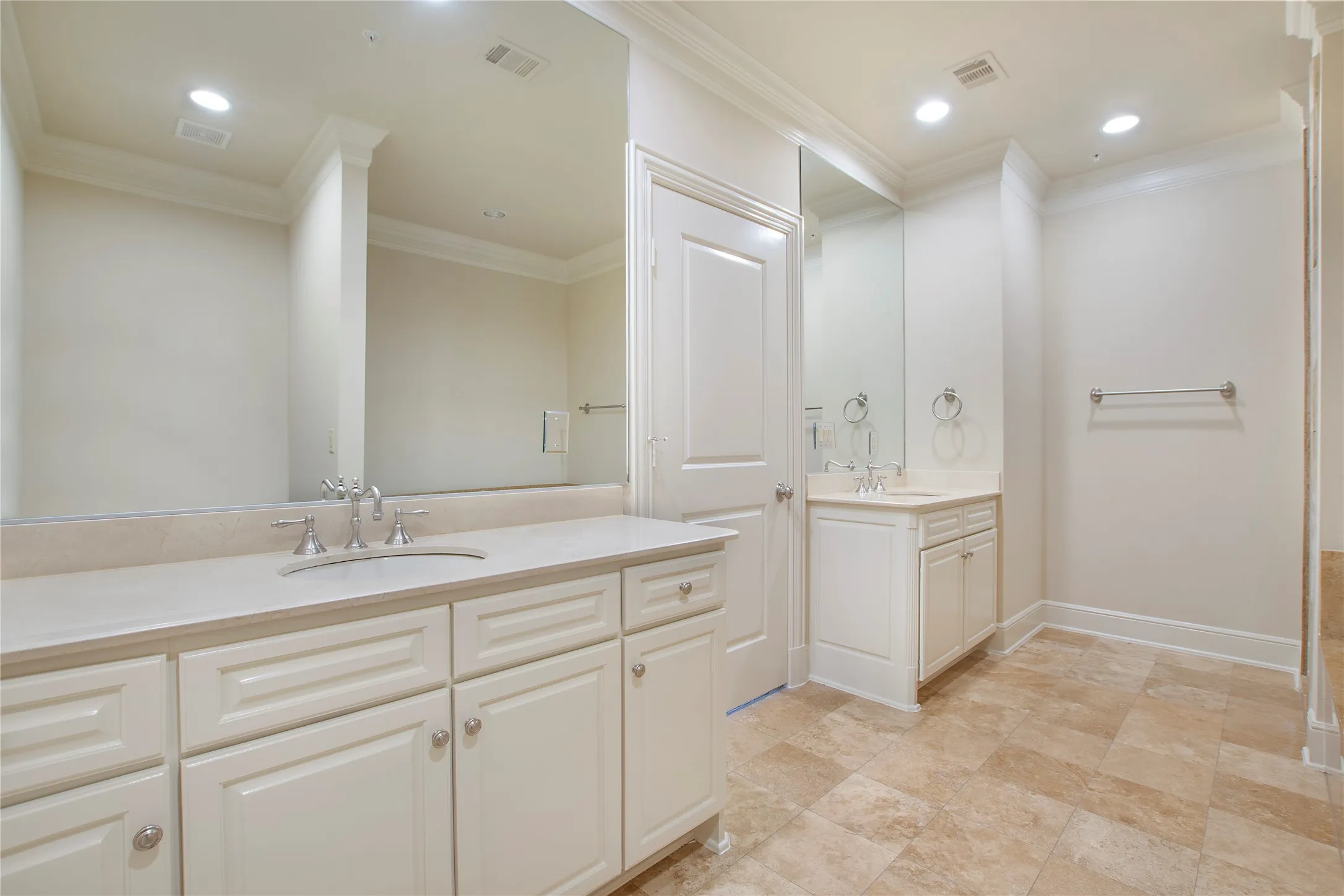 Bathroom featuring vanity and ornamental molding