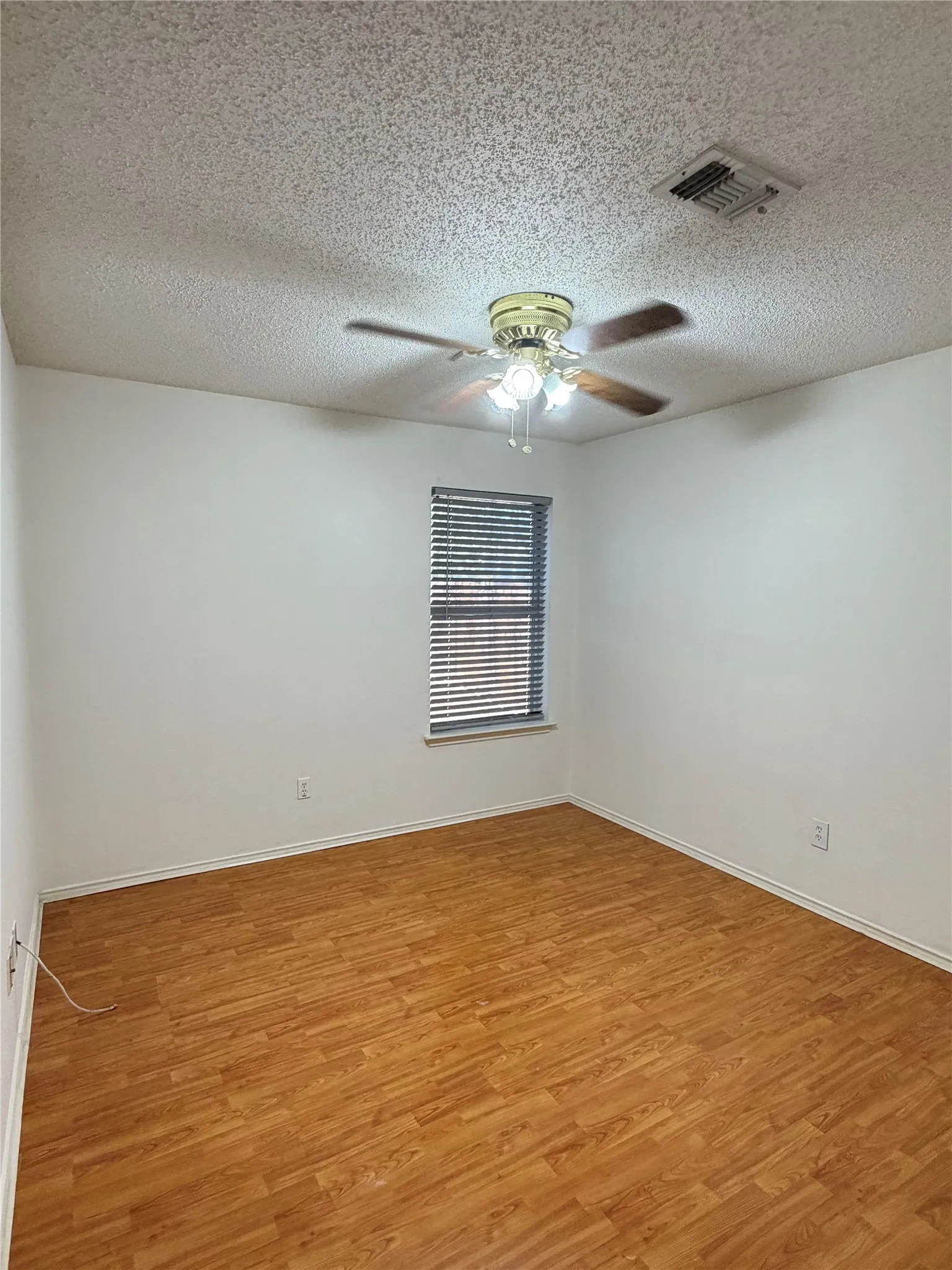Wood-finish flooring with white walls
