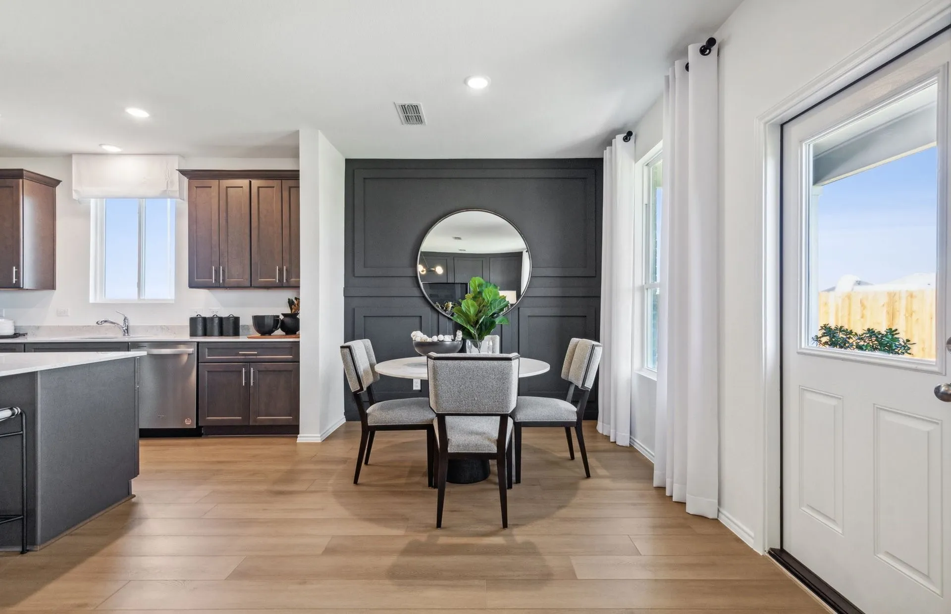 *Model Representation - Dining area off kitchen with large windows