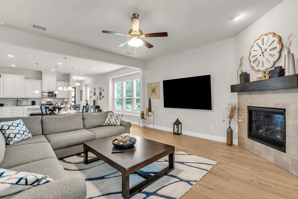 Open concept living area with wood-finish flooring
