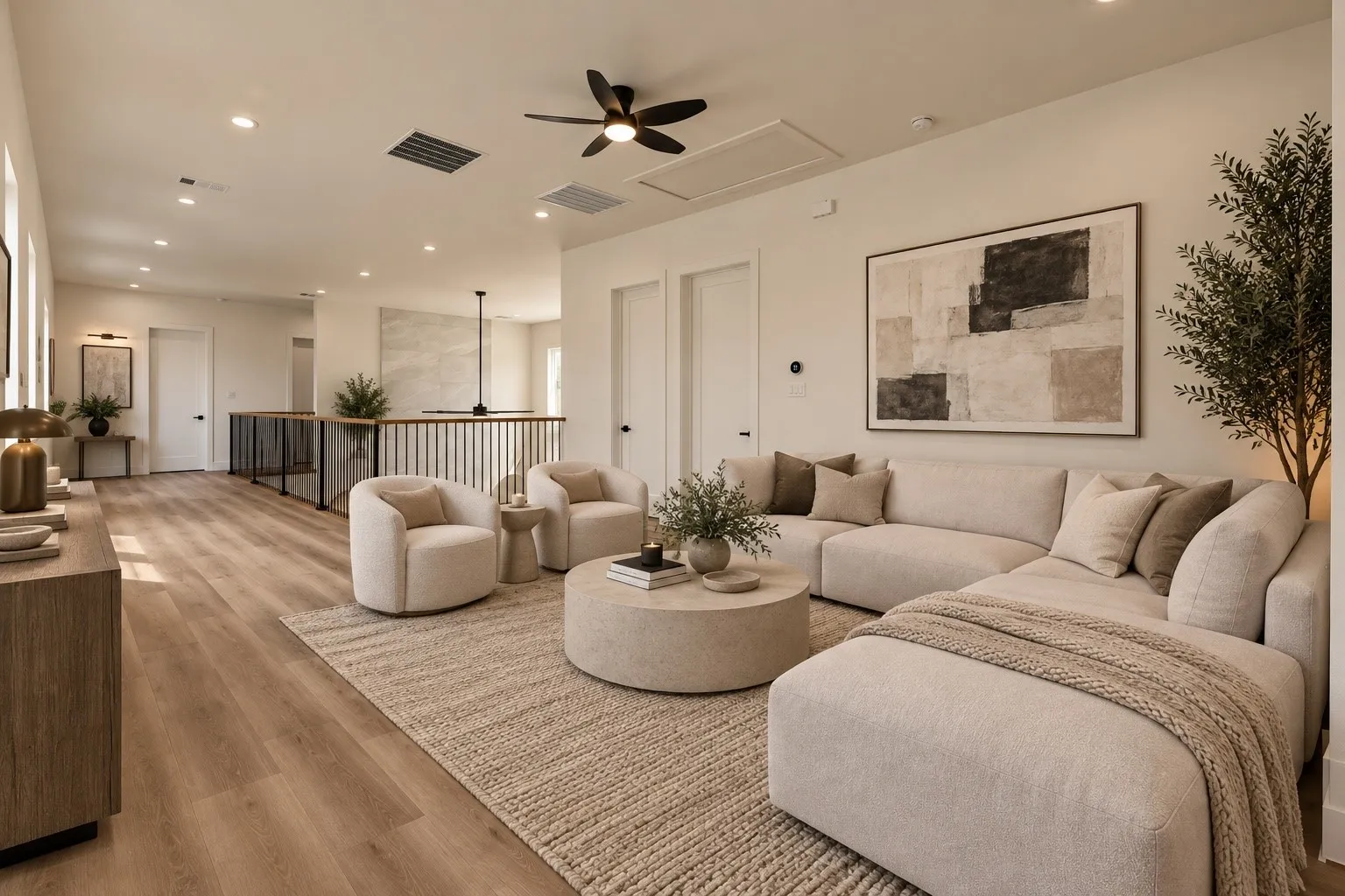 Open-concept living space with wood-finish flooring, recessed lighting, and a ceiling fan