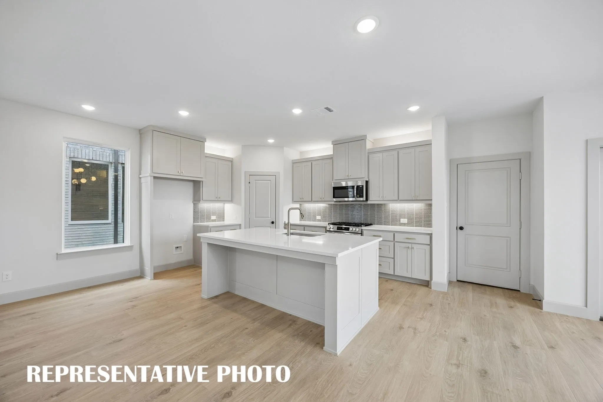 Light and bright, all the chefs in the family will enjoy ample storage and prep space in this dream kitchen!REPRESENTATIVE PHOTO