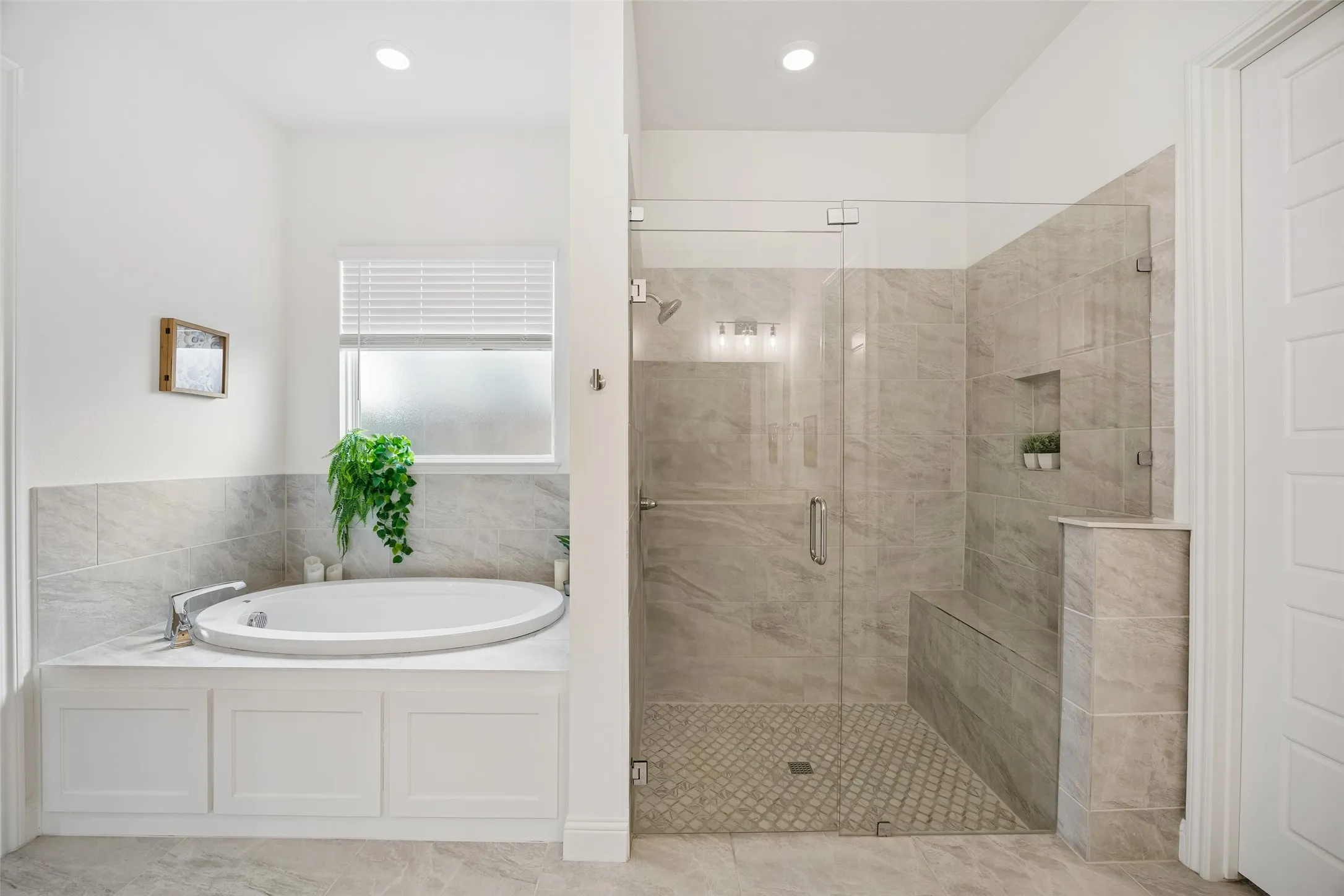 Primary bathroom with separate shower with bench