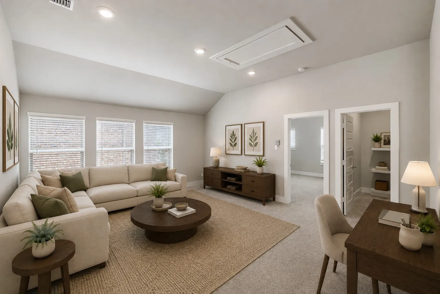 Spacious living area with vaulted ceiling, recessed lighting, multiple windows, and carpeted flooring