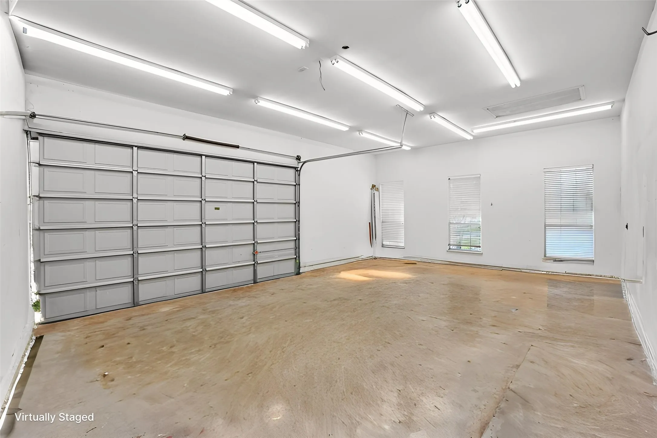 So many possibilities with this 20' x 28' space with private entrance door with 12' high double garage door and 220 outlet. Great space for hobbies, work area or in law suite.