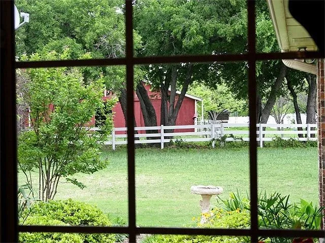 Clear view of horse barn in neighbor's yard.