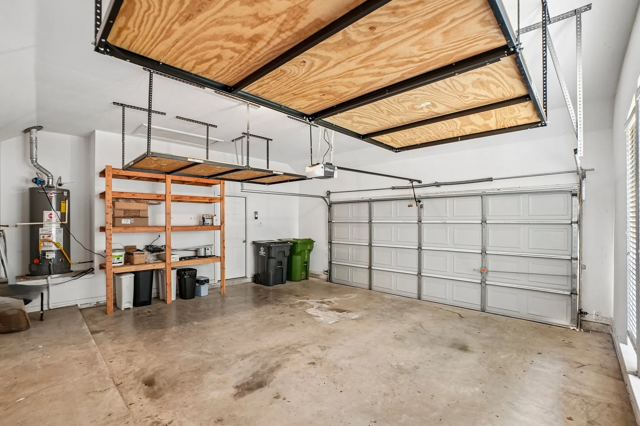 2 car front garage with extra storage shelves.