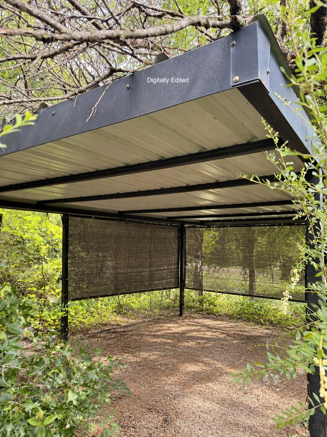 Open-sided metal-roofed storage shelter