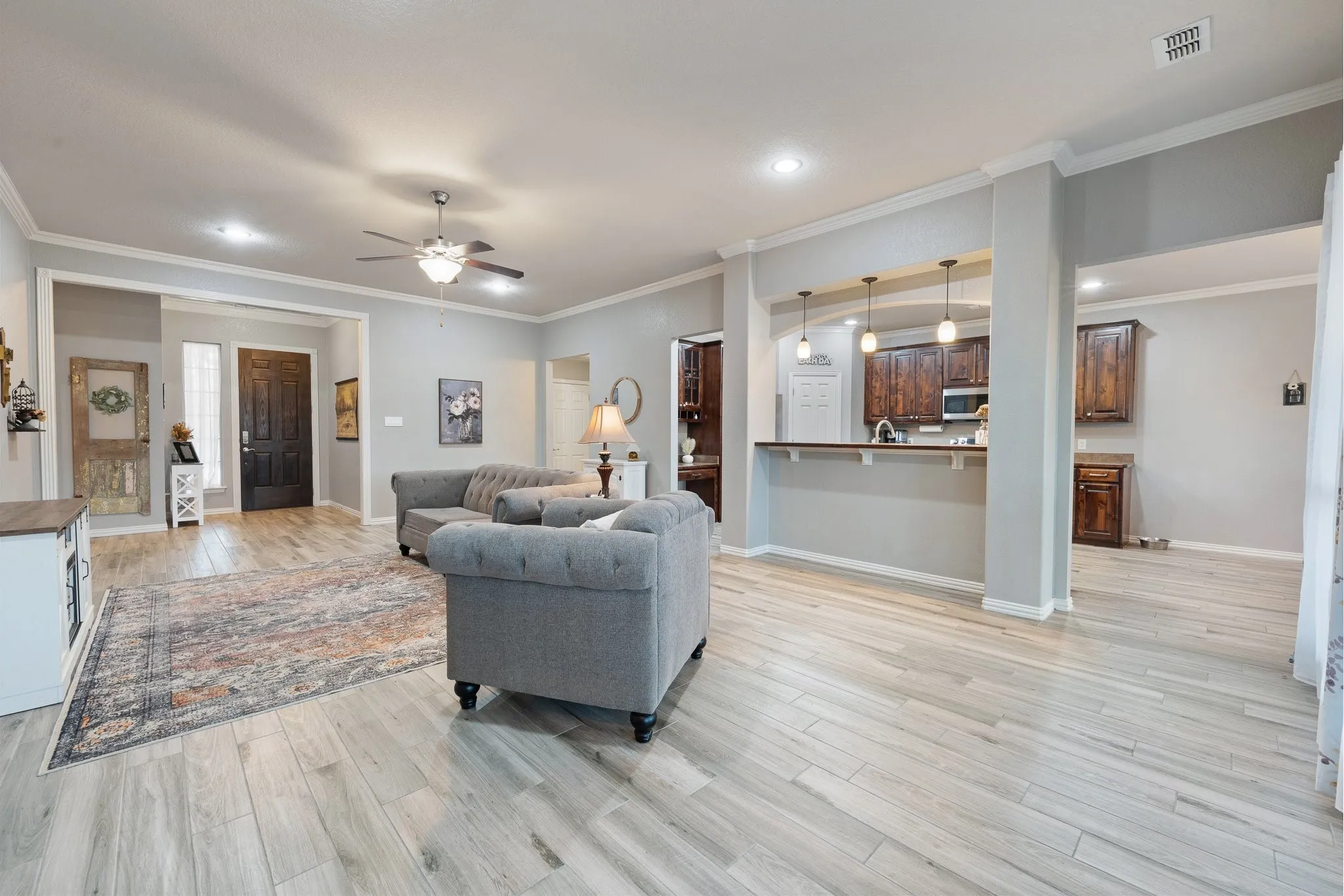 Here's the living room, looking towards the front entryway. You can see how the living room is open to the kitchen.