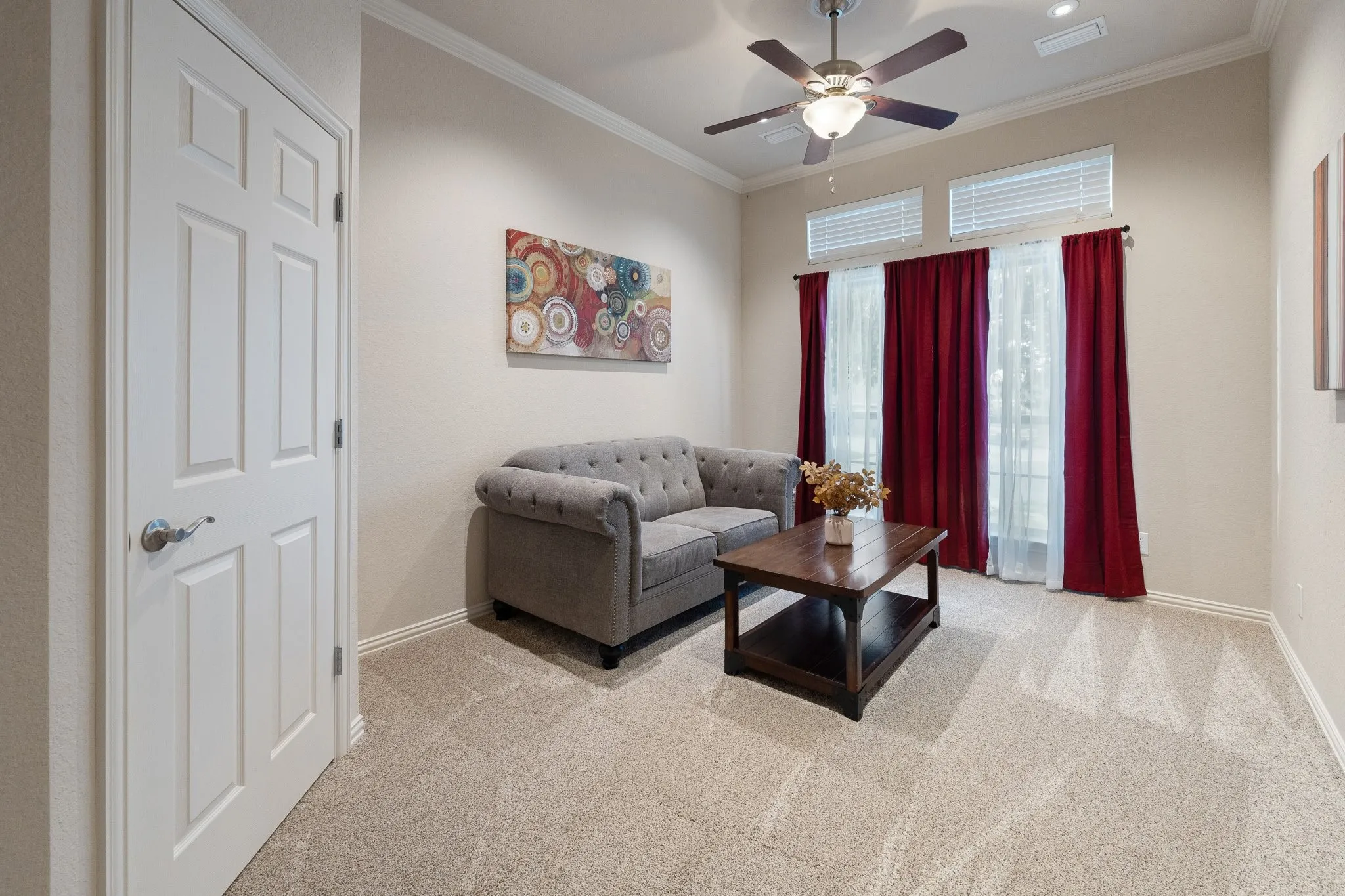 This fourth bedroom is being used as an office or second living room.