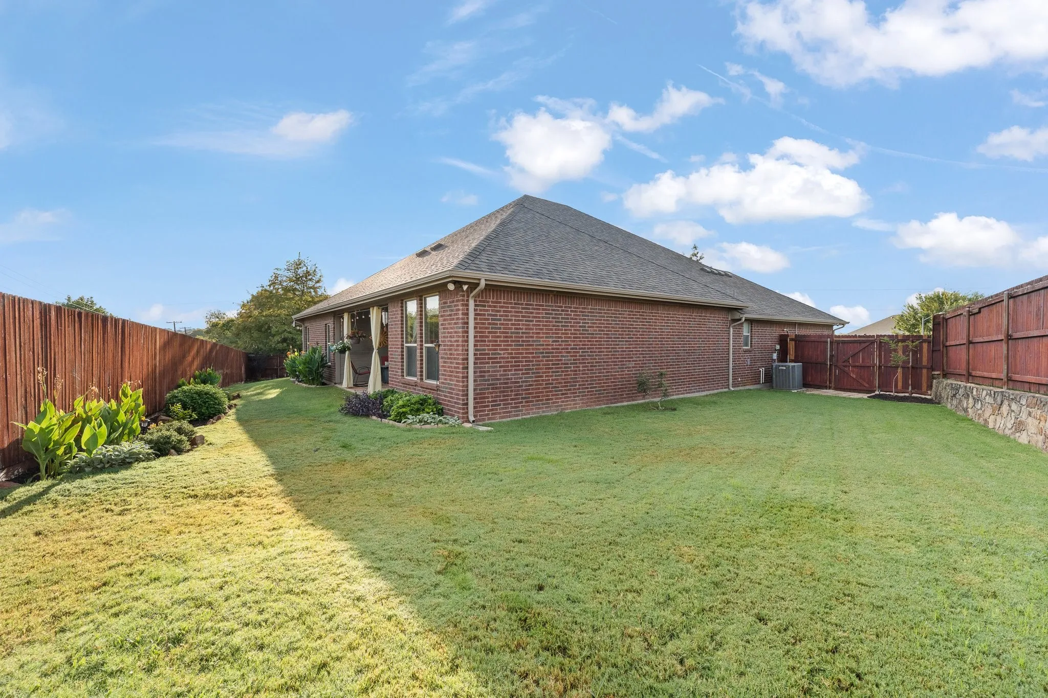 The size of this yard is deceiving! You could play soccer on this side yard!