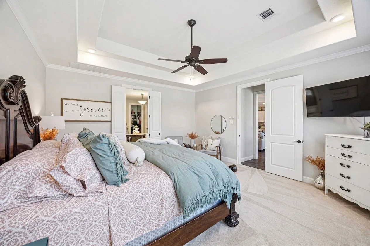 Tray ceiling with recessed lighting and crown molding