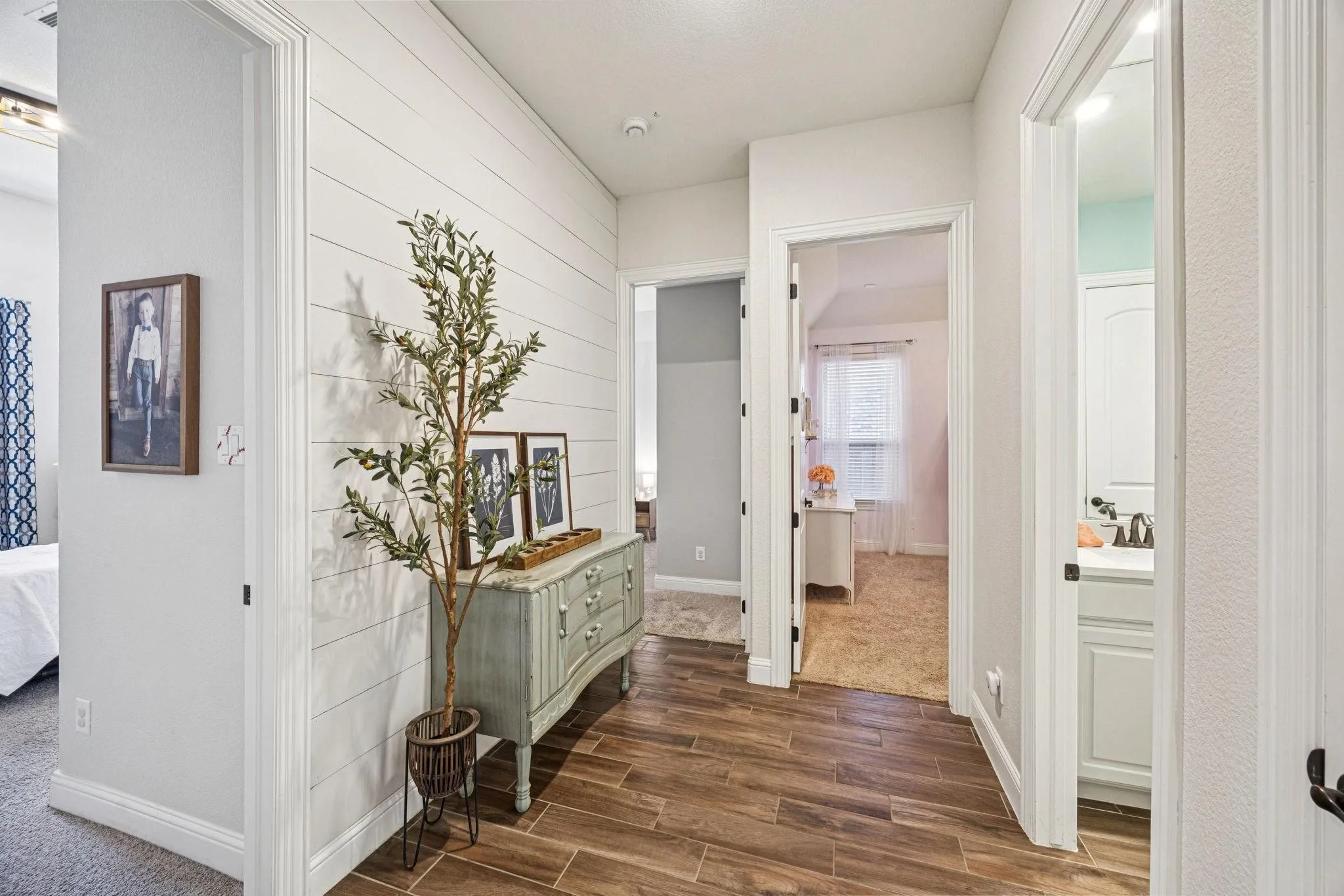Wood-finish plank flooring throughout