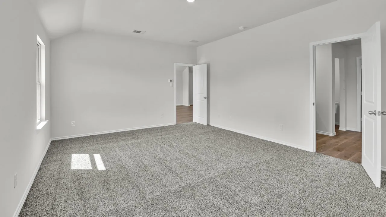 Vaulted ceiling, carpeted flooring, white walls, double-hung window, recessed lighting