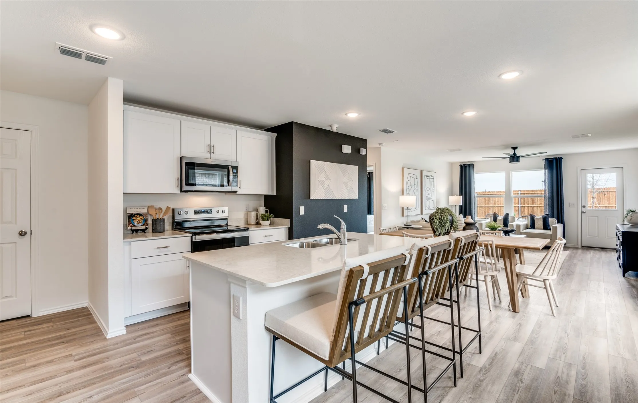 *Model Representation - Large island overlooking gathering room and dining areas