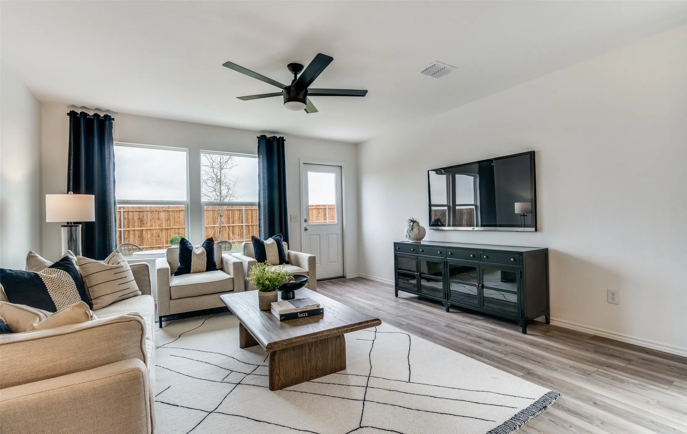 *Model Representation - Spacious gathering room with large windows