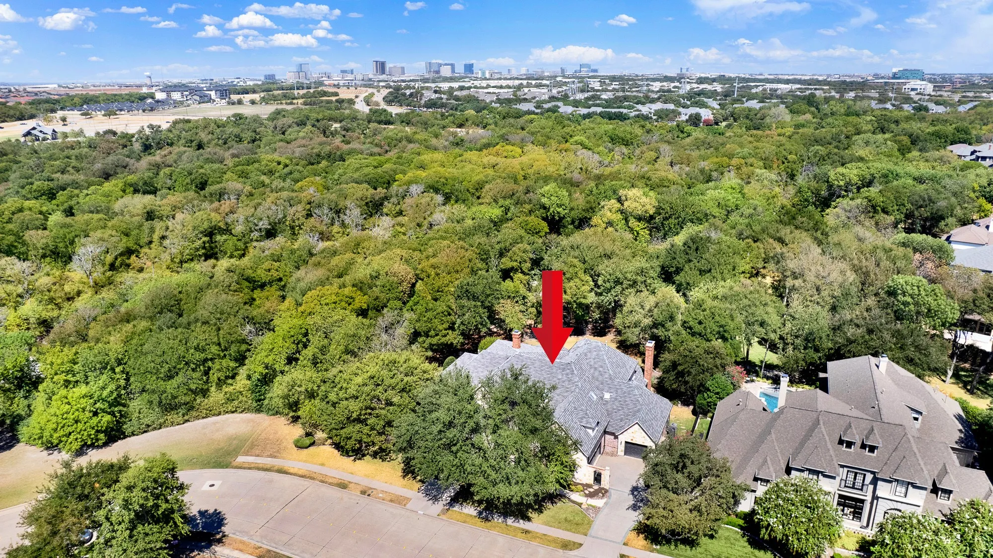 Positioned perfectly along a quiet treeline street, the home borders a massive green canopy stretching toward the horizon. Enjoy peaceful evening sunsets from your front lawn while taking in the endless natural views.
