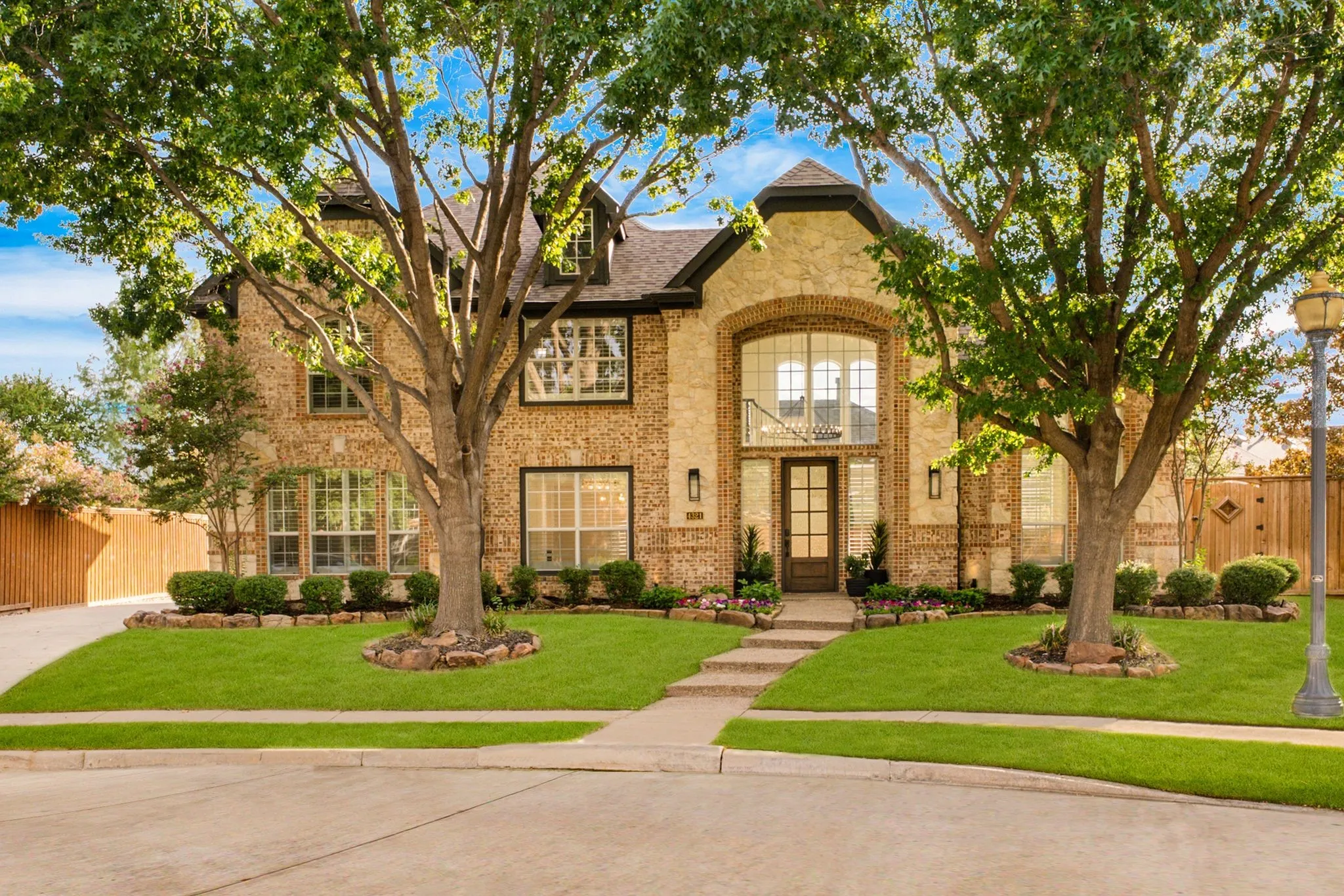 Brick and stone exterior with architectural dormer windows
