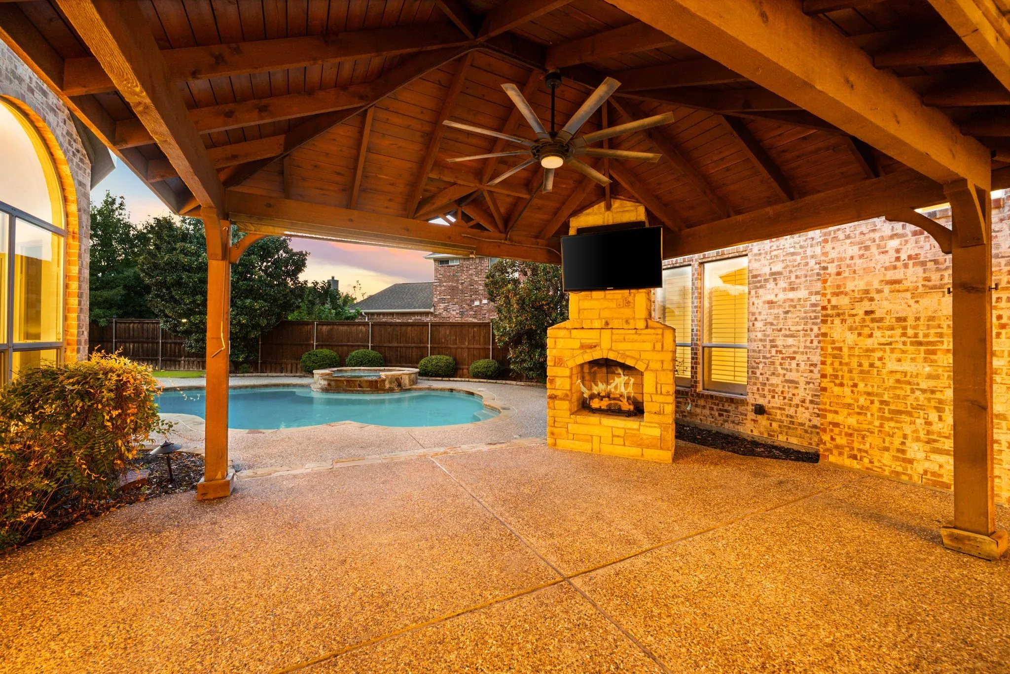 Covered patio with a wood ceiling, recessed lighting, and a ceiling fan