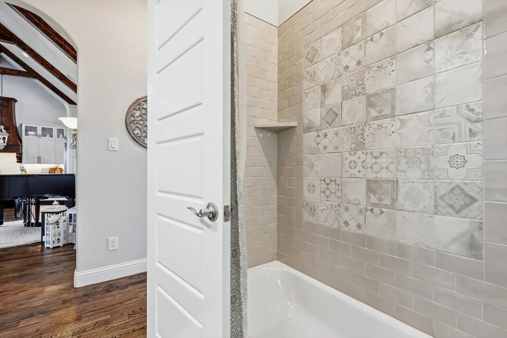 Bath #2 has special tile details in the tub-shower
