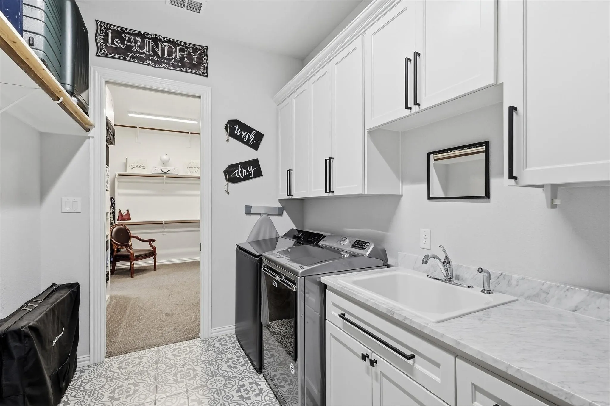 Laundry room with sink and room for extra frig.  Door ahead is to Primary closet