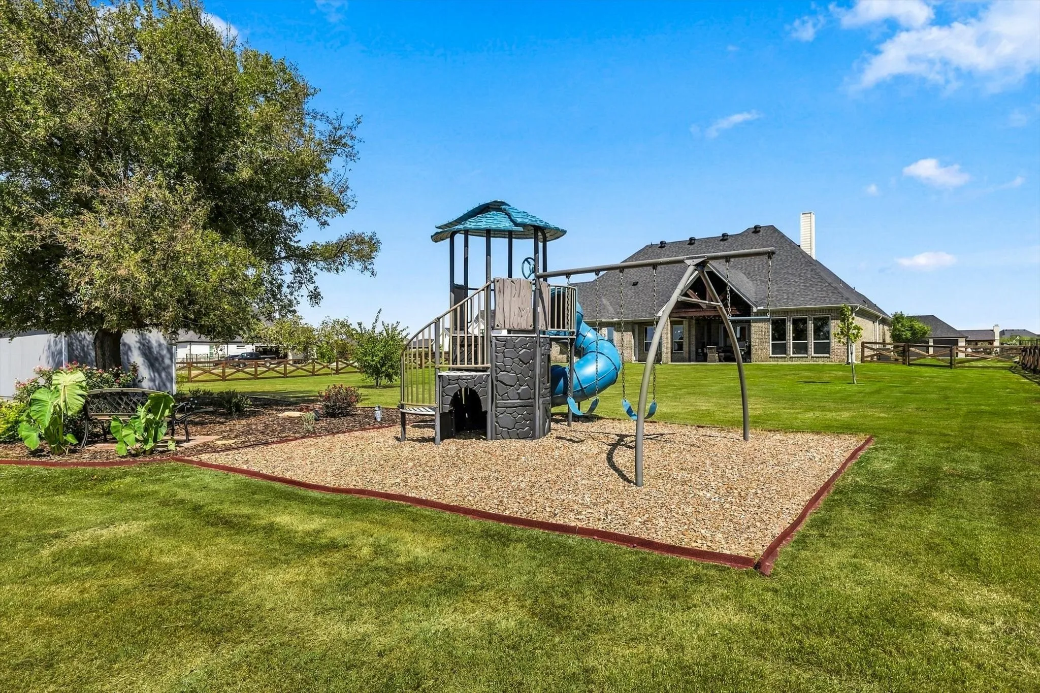 Playfort conveys.  The yard is sprinklered from the playset east to the rest of the property.