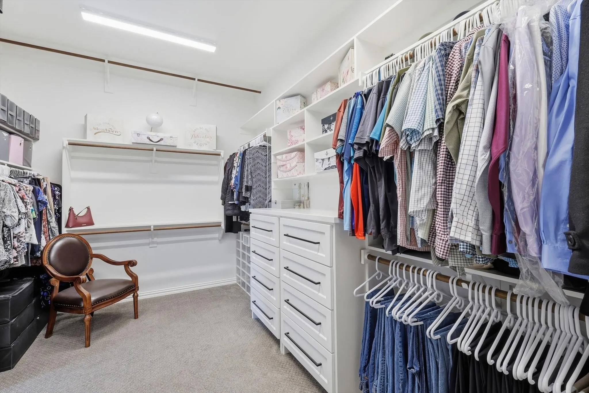 Primary closet has built-in dressers and shelving.  Direct access to laundry room