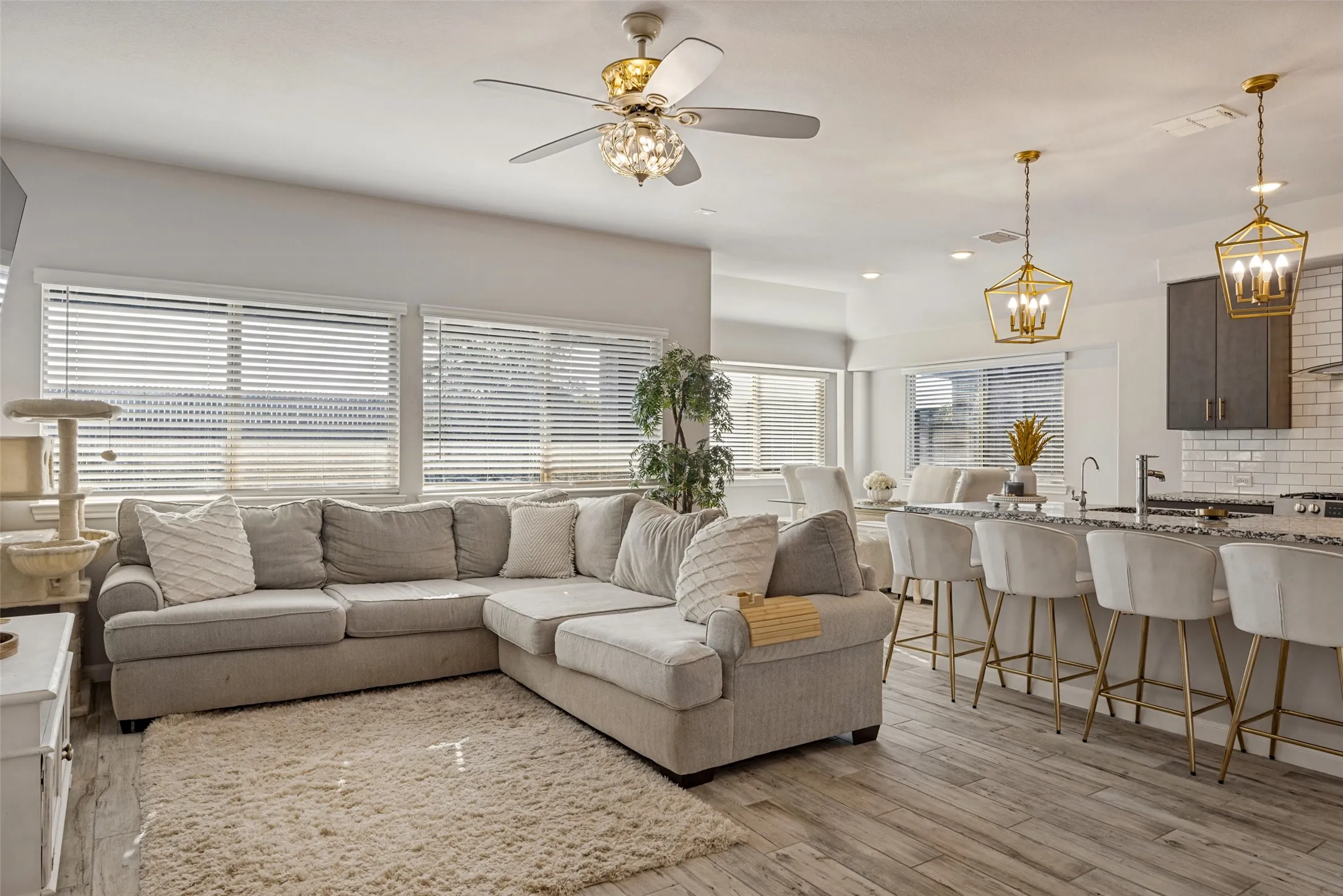 Open concept living area with wood-finish flooring