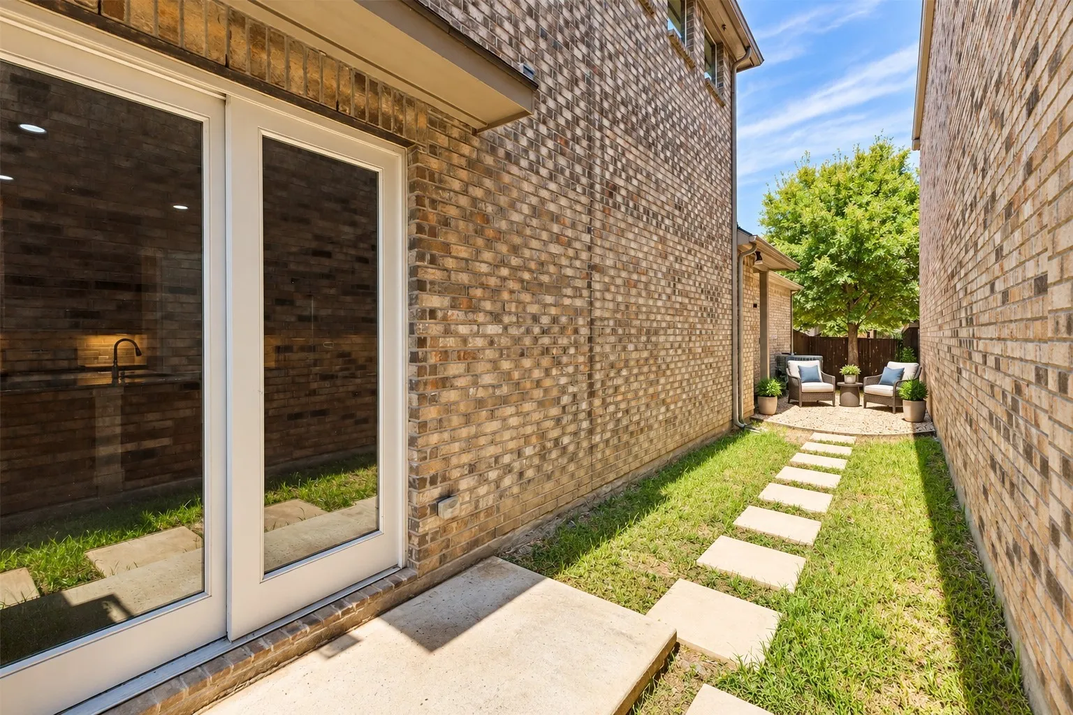 Side yard for grilling and grass for pets - virtually staged