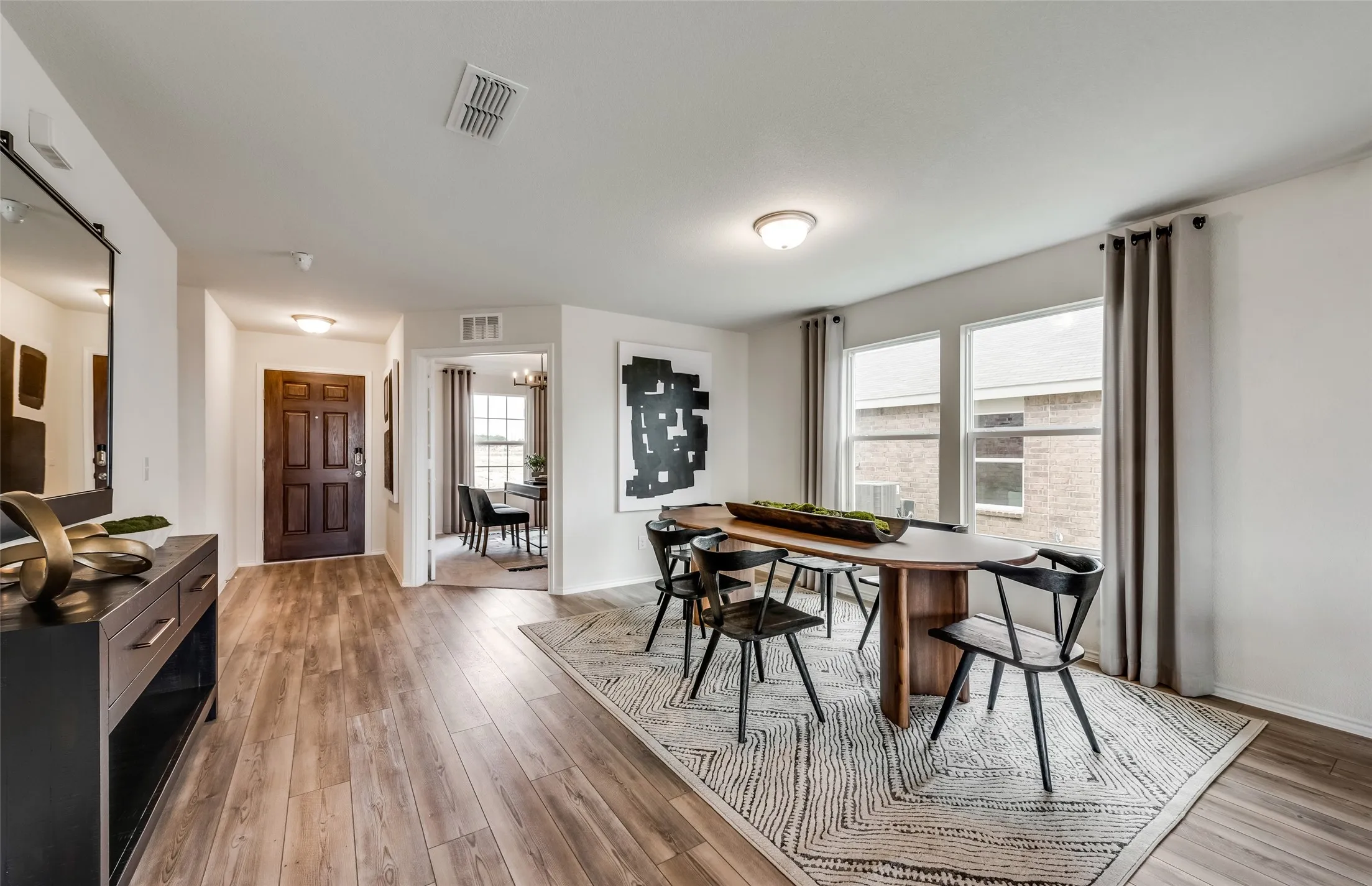 *Model Representation - Dining area off kitchen with large windows
