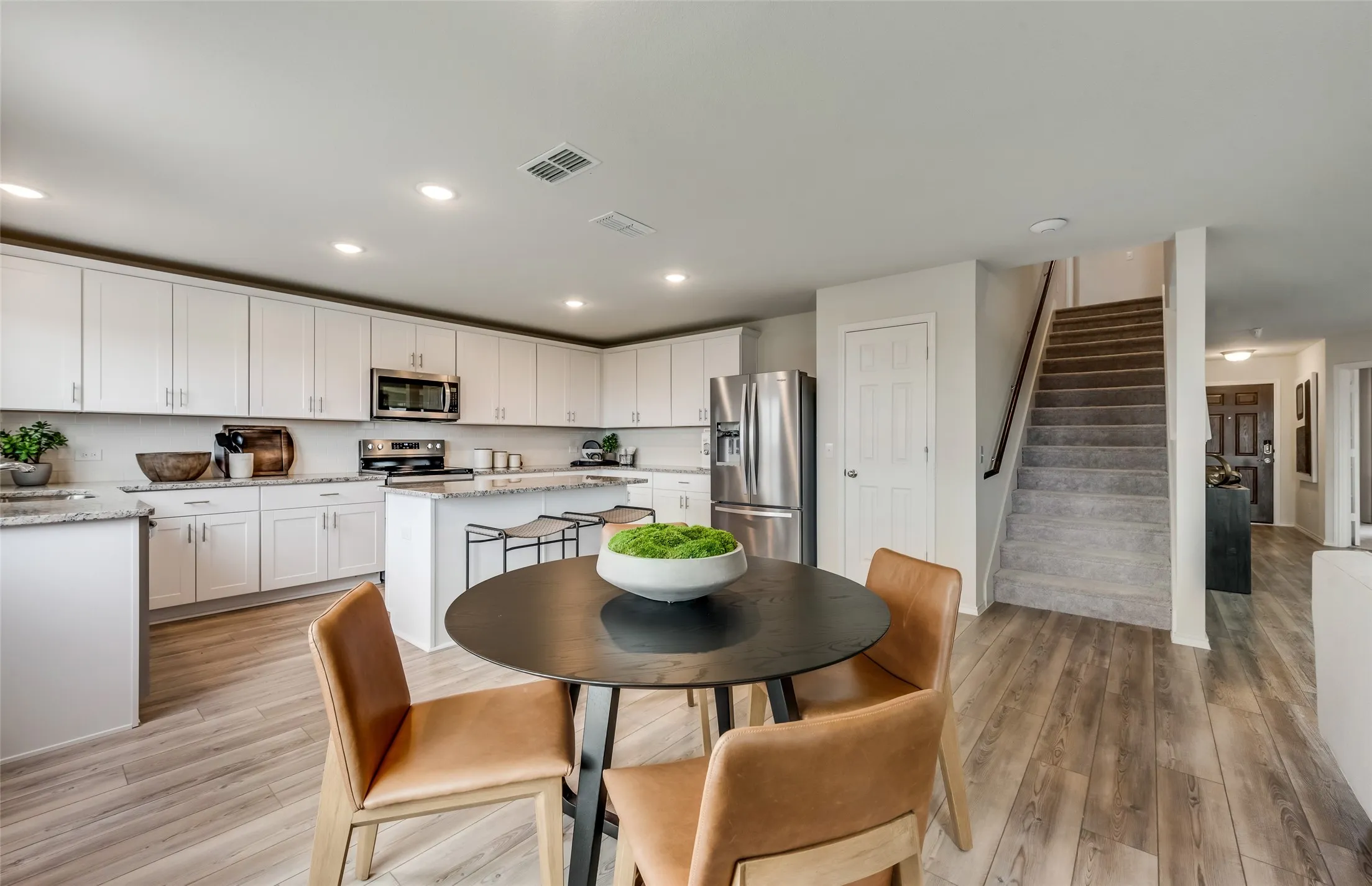 *Model Representation - Dining area off kitchen with large windows