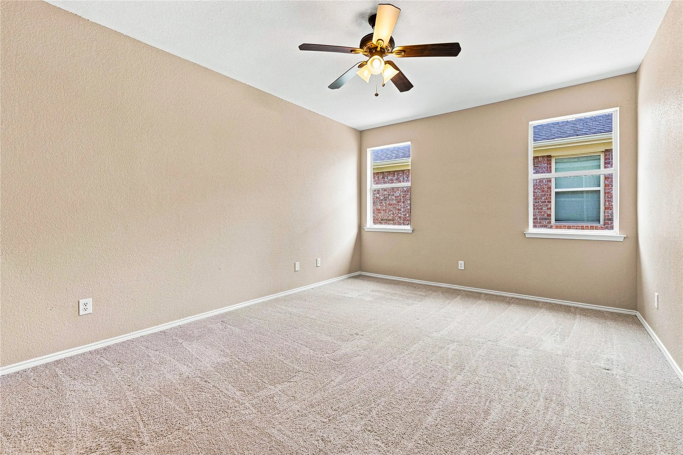 Recessed lighting, ceiling fan, and dual windows