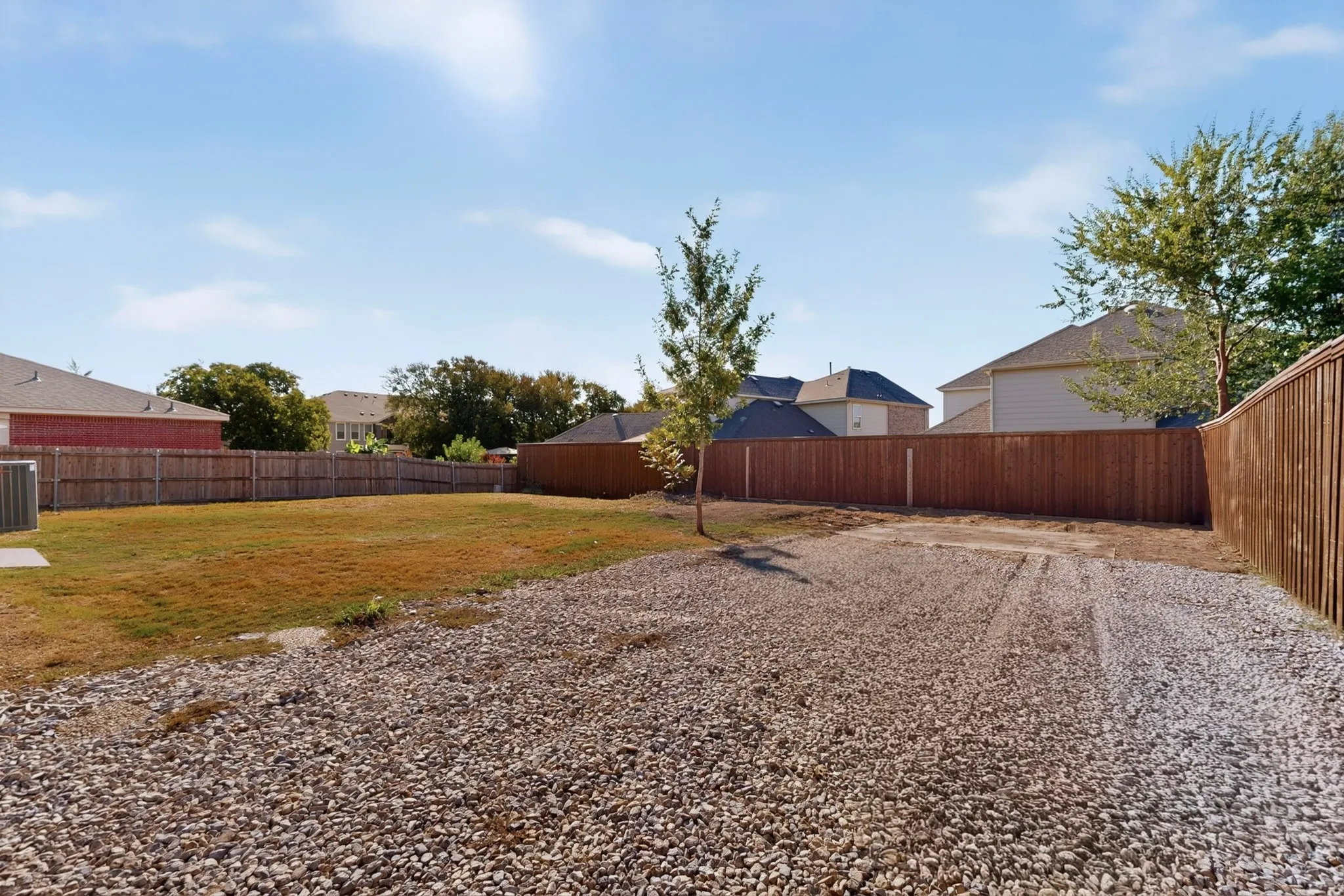 Additional gravel parking and usable space alongside the home provide added convenience and flexibility. With versatile outdoor areas and room to make it your own, this property offers many possibilities for a variety of needs.