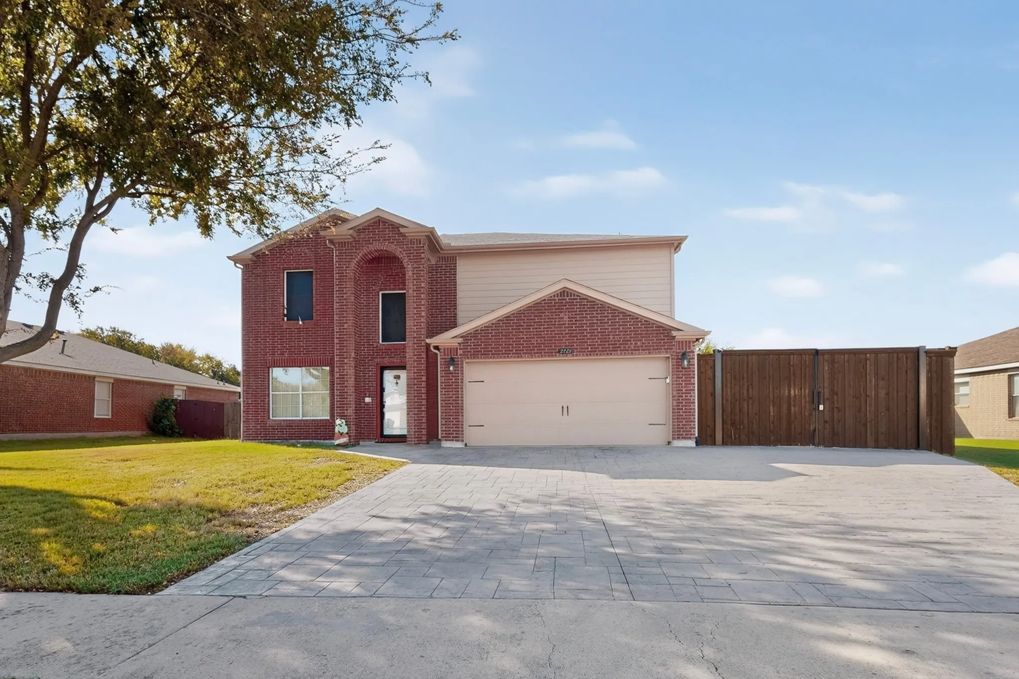 Beautiful two-story home, situated on an extra-large lot with stamped concrete.
