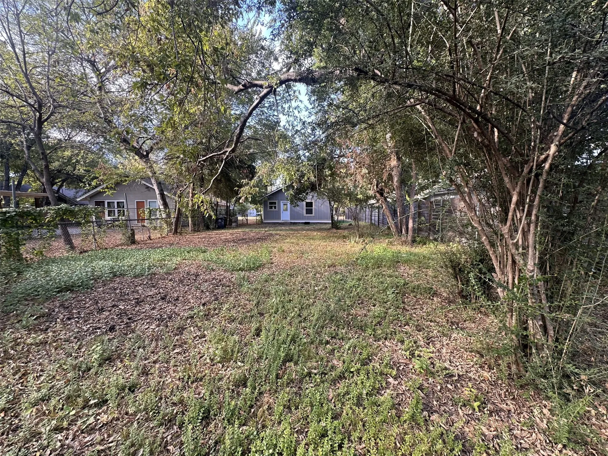 Expansive lot featuring mature trees and established greenery
