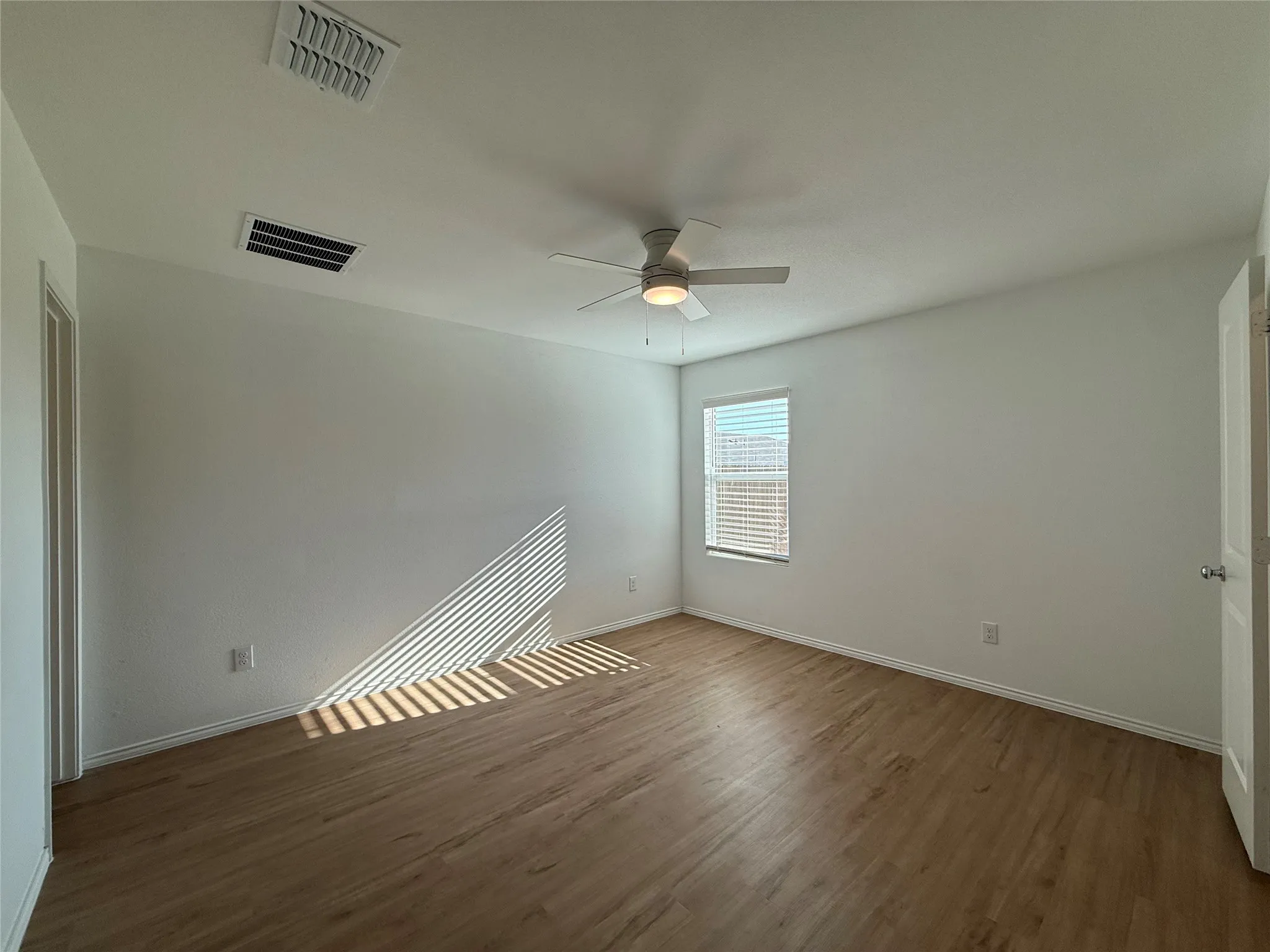 Wood-finish flooring with white walls