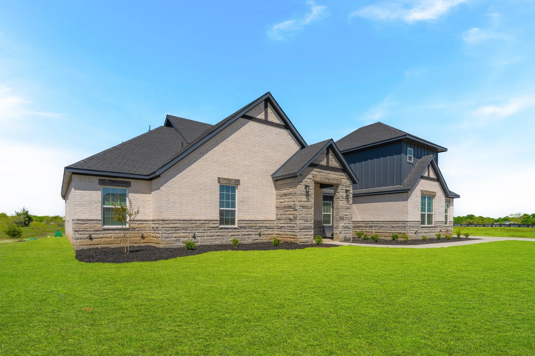 Stone and brick exterior with dark trim accents