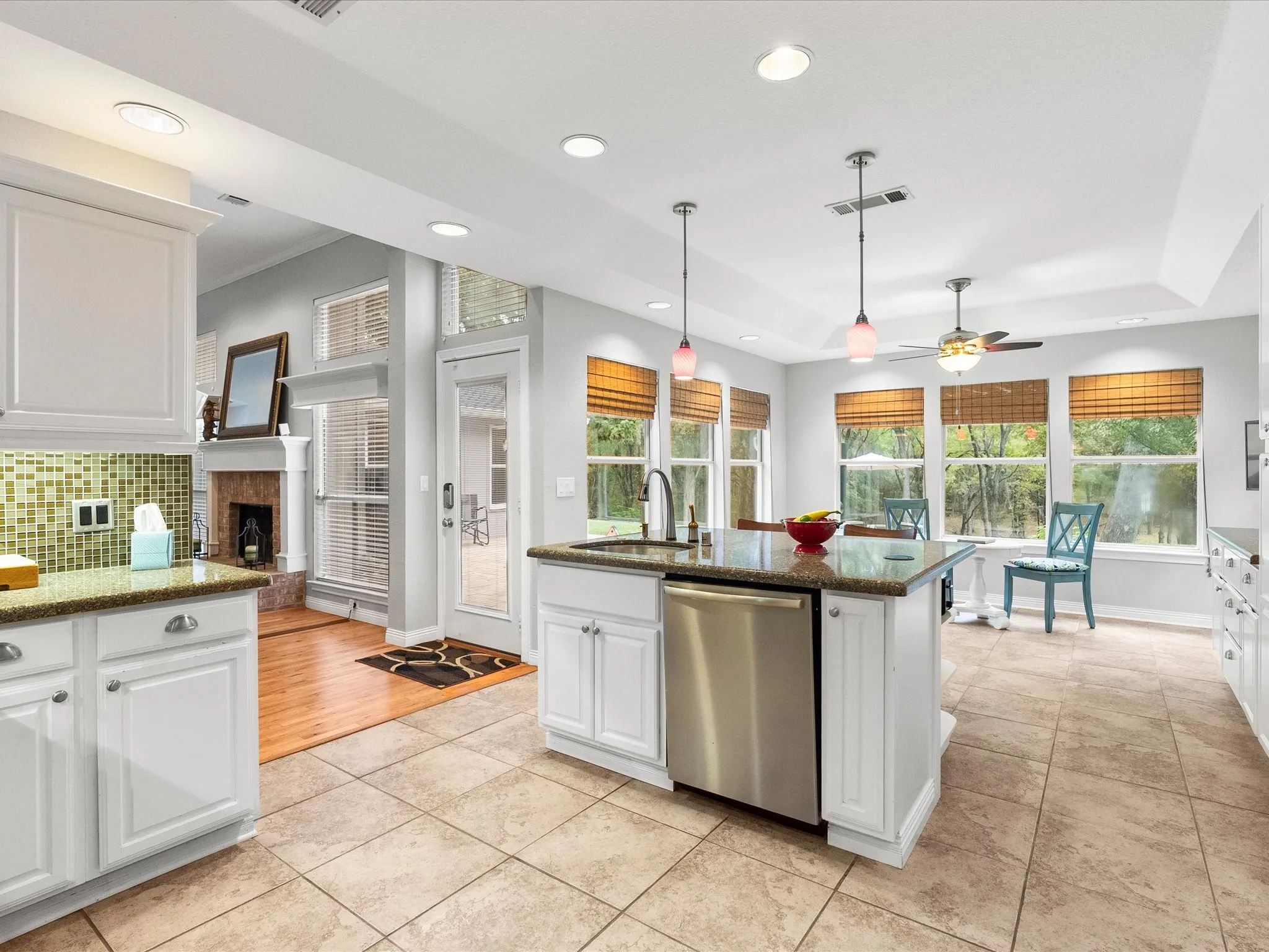 Kitchen view of Eat In Breakfast Nook, and Large Windows overlooking backyard.
