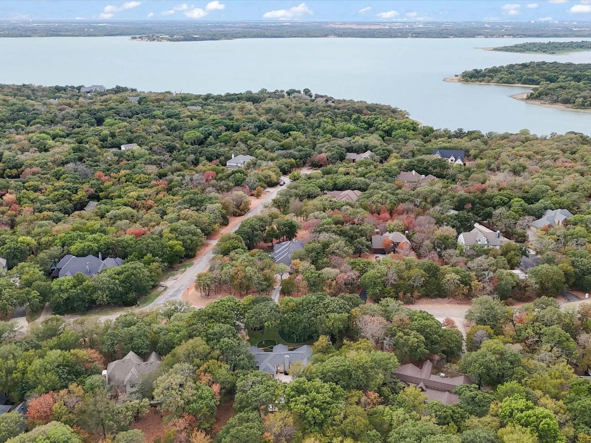 Aerial View with the home in the foreground and Lewisville Lake in the Background.