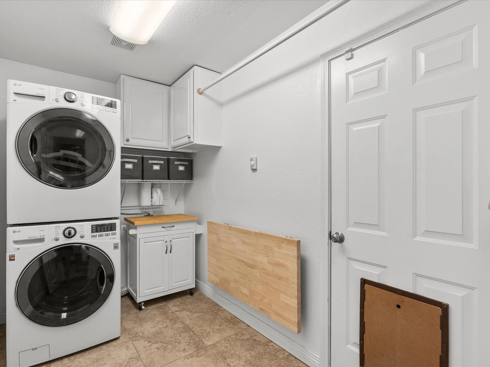Laundry Room Featuring Space Saving Folding Table