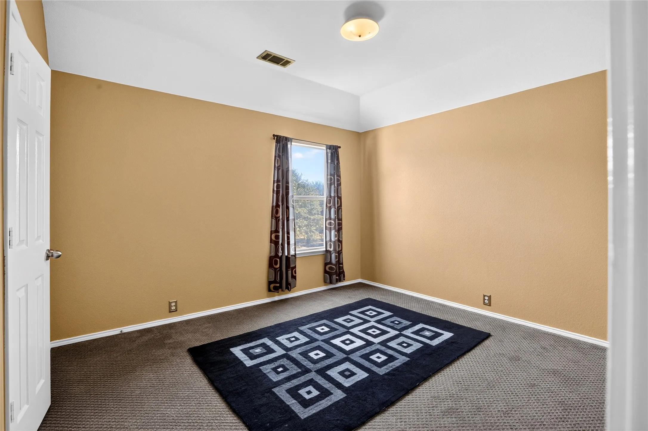 Recessed tray ceiling with a flush-mount light fixture
