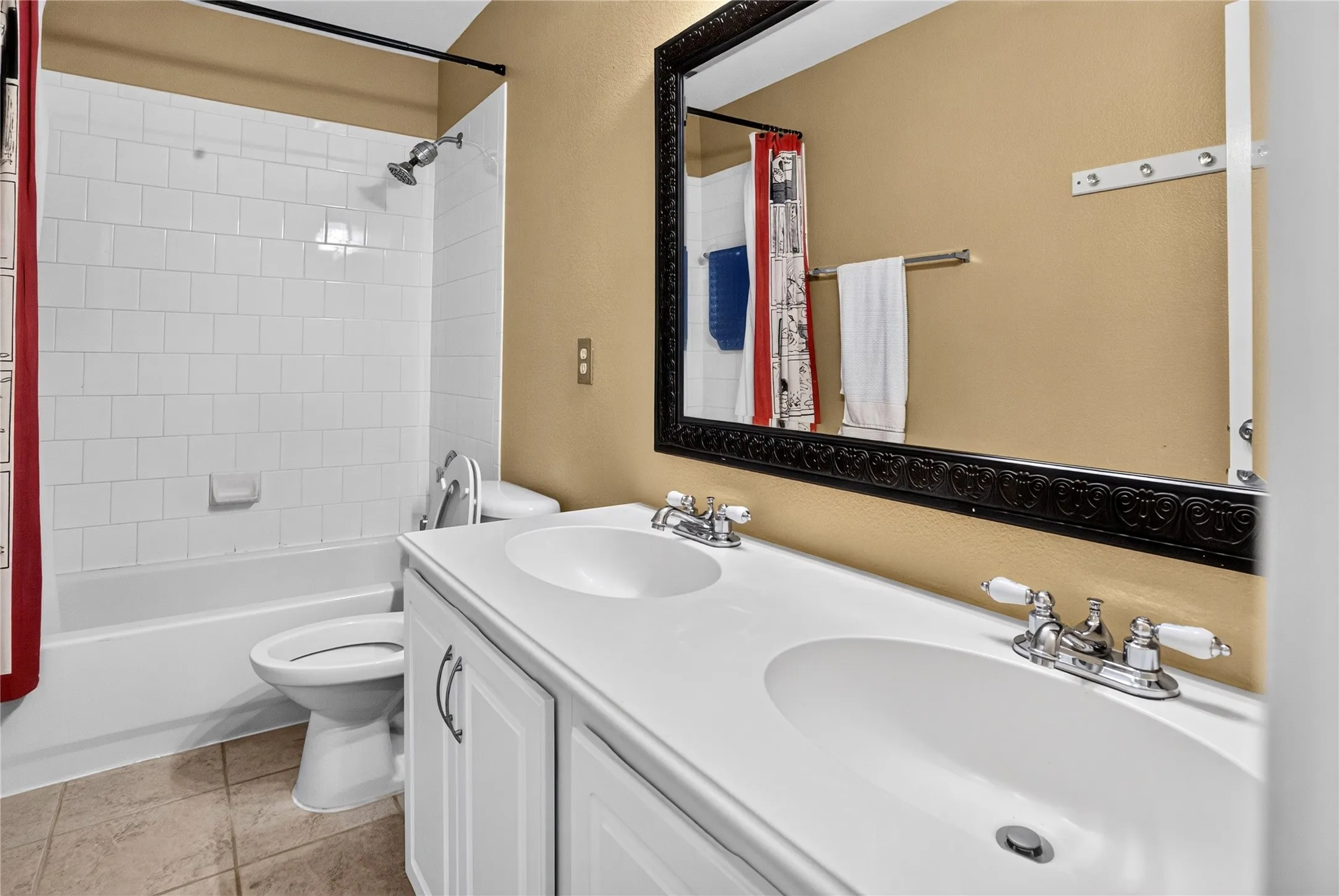 Dual vanity with integrated sinks, chrome faucets, and white cabinetry