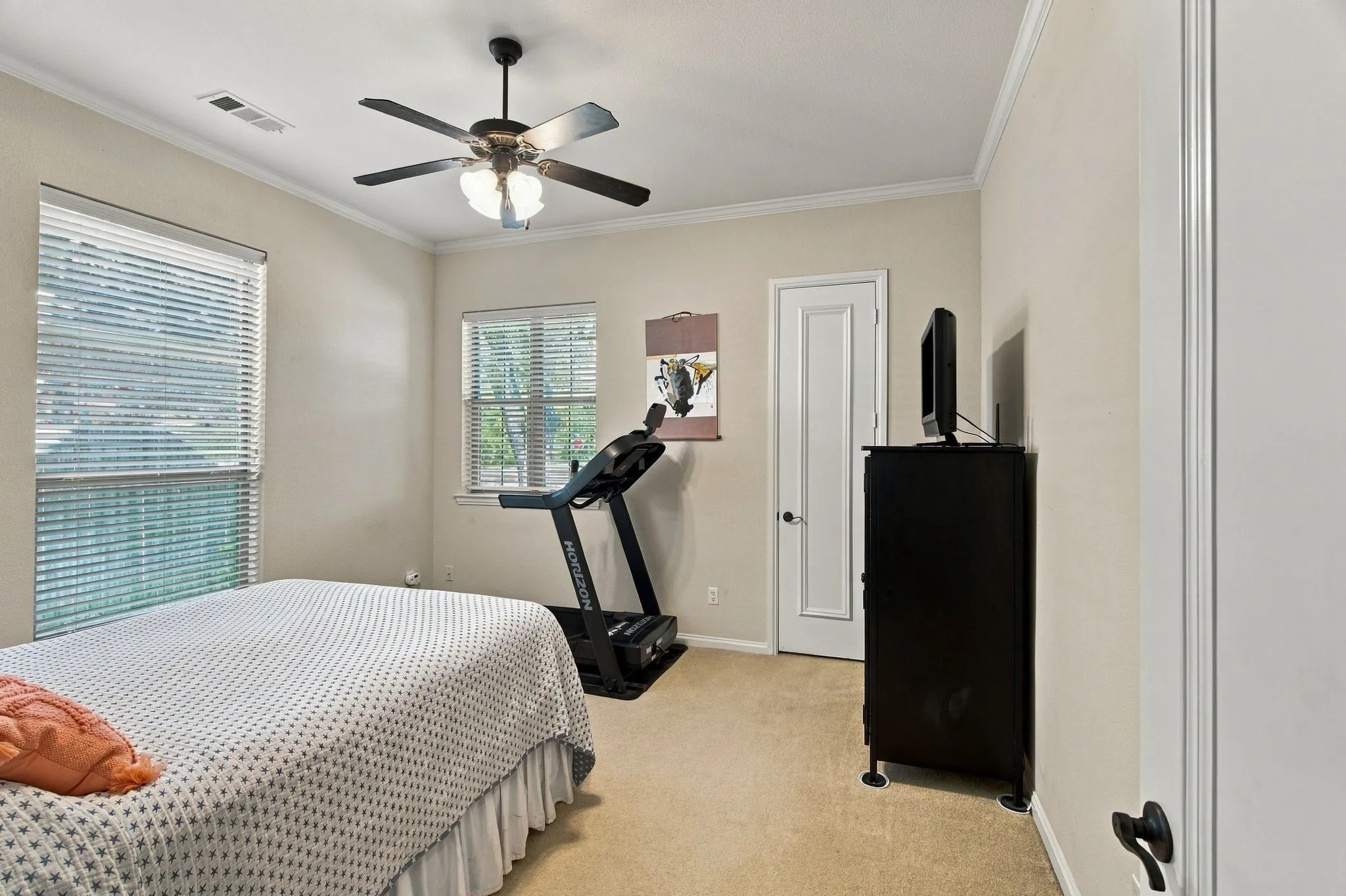 Recessed lighting, ceiling fan with light fixture, two windows with blinds, and light-colored walls
