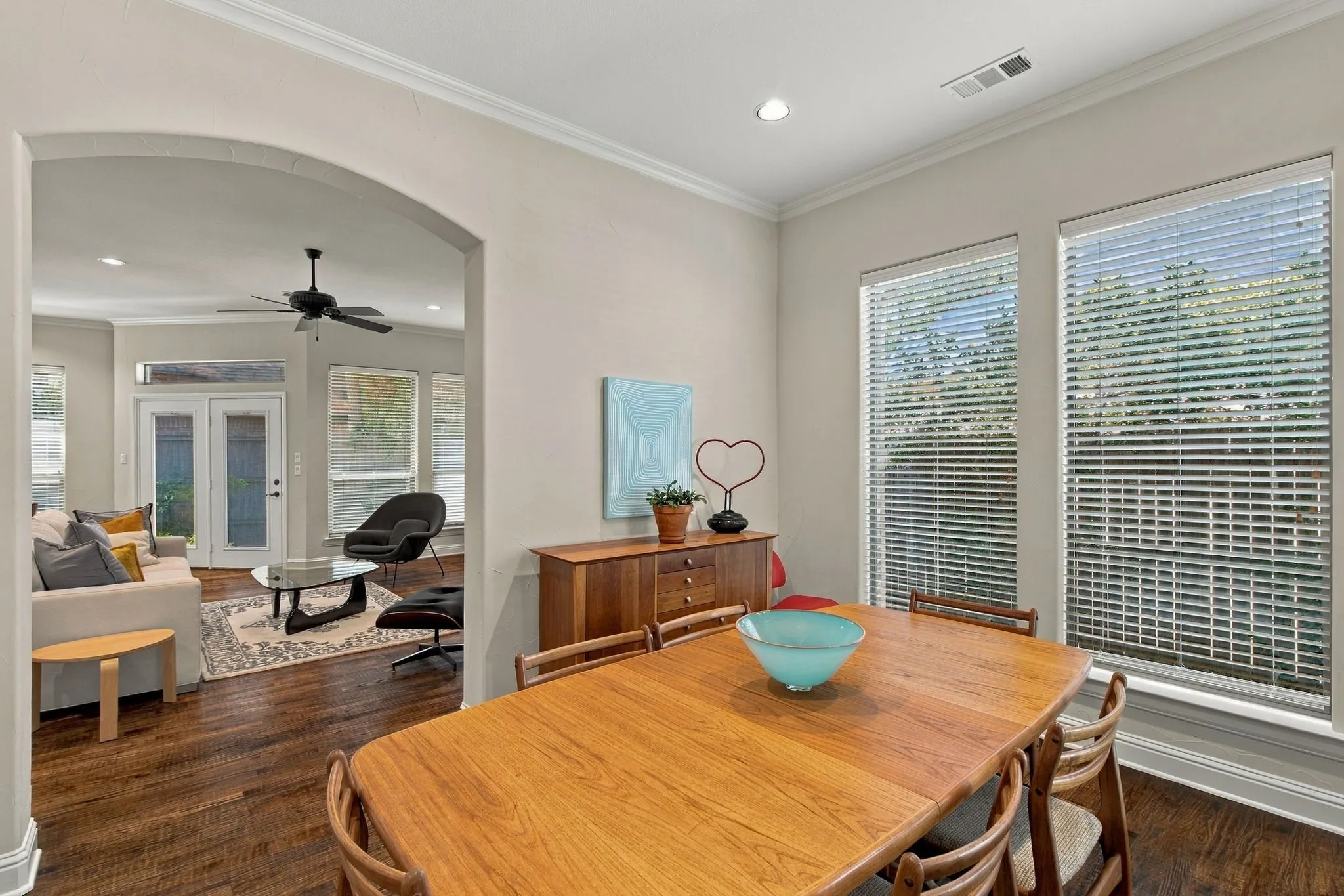 Scraped Custom Hardwood flooring complemented by an arched doorway