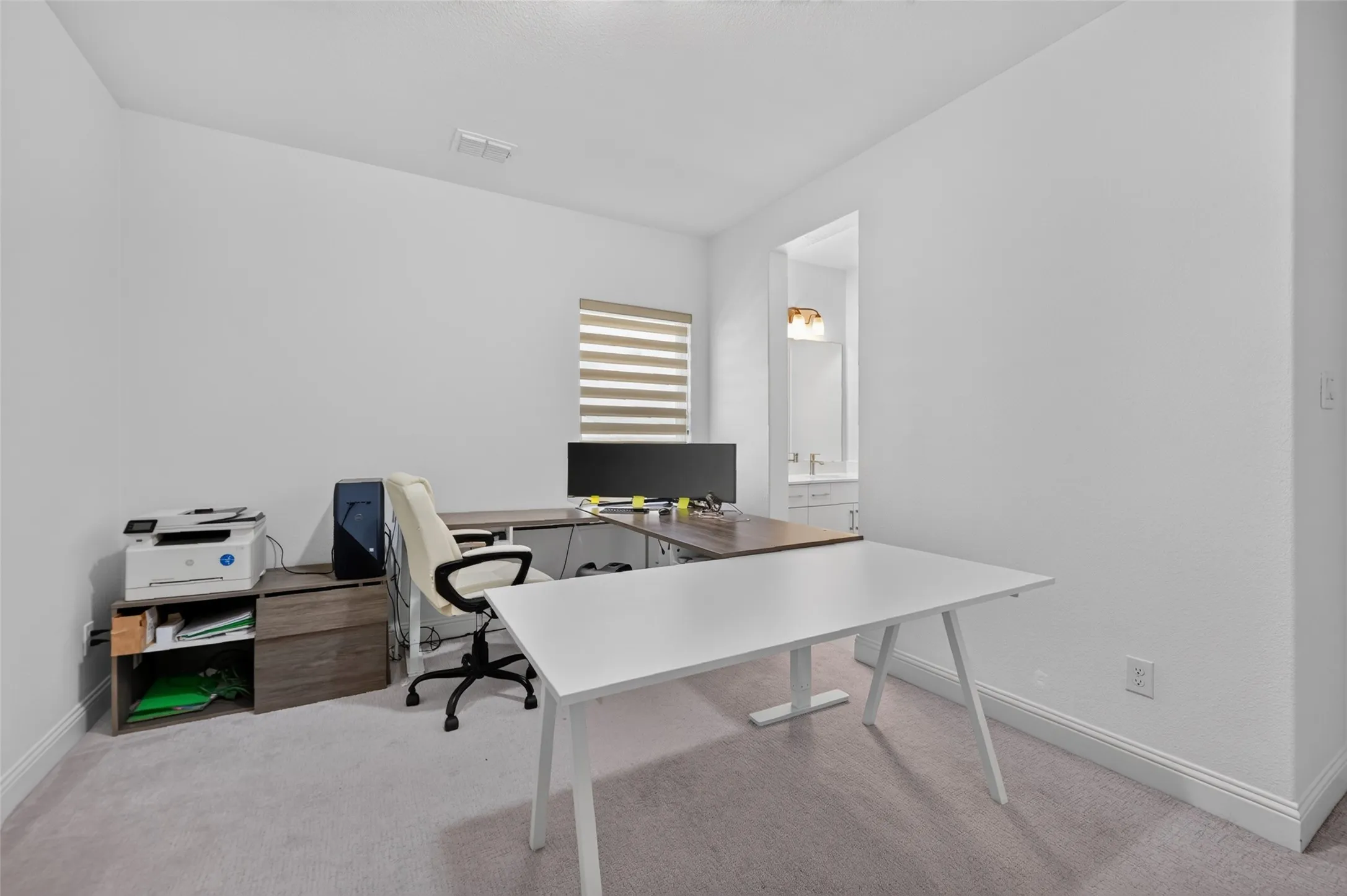 Secondary bedroom being used as an office.