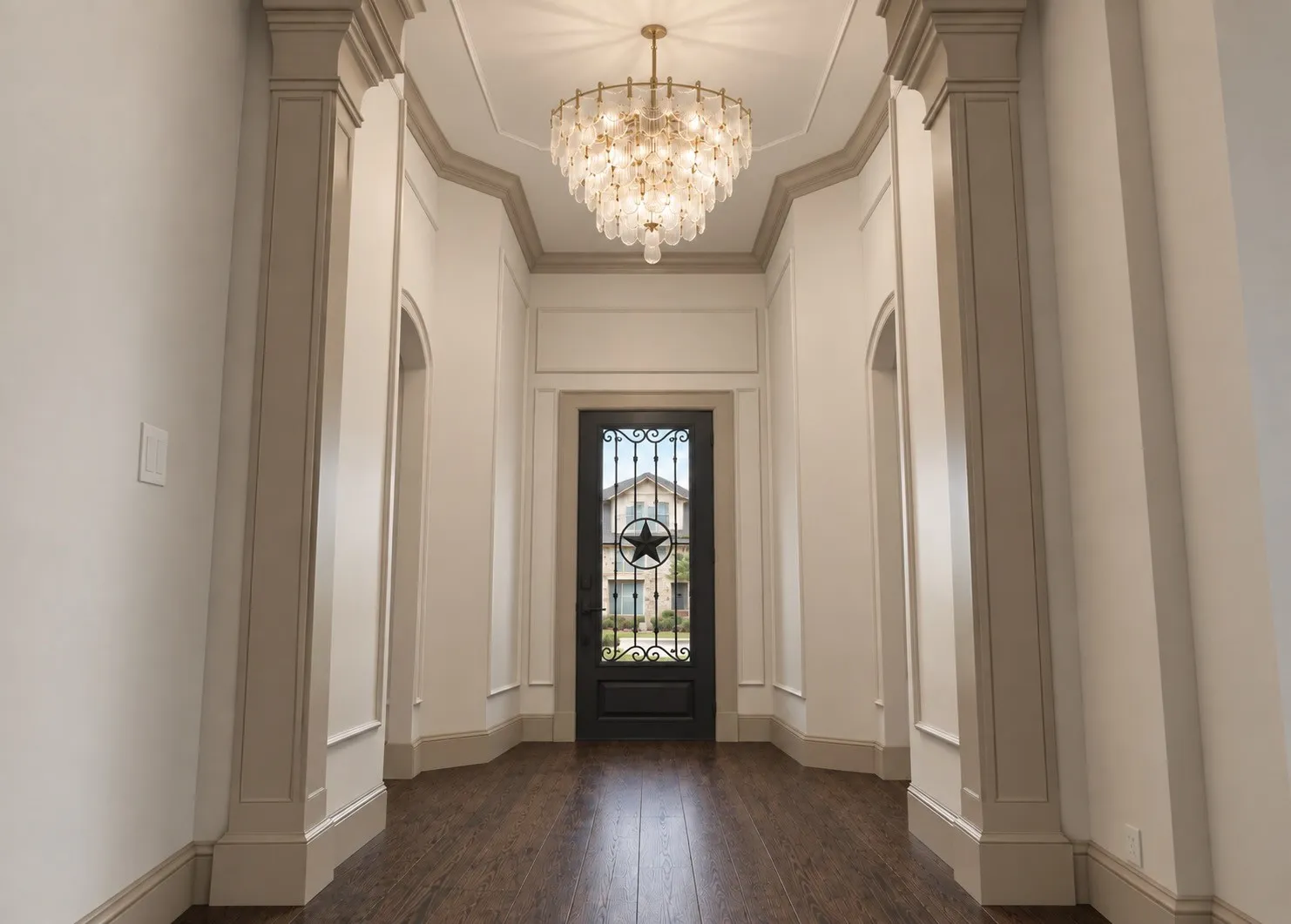 A Texas-sized iron door opens to a stately foyer with soaring 14’ ceilings, statement lighting, graceful arches, and curated millwork, creating a striking intro to the breathtaking open-concept living space where engineered hardwood floors flow throughout the main areas.Rendering Disclaimer: Images are artist renderings intended to illustrate the anticipated finished home. Final finishes, materials, colors, fixtures, landscaping, and other details are subject to change.