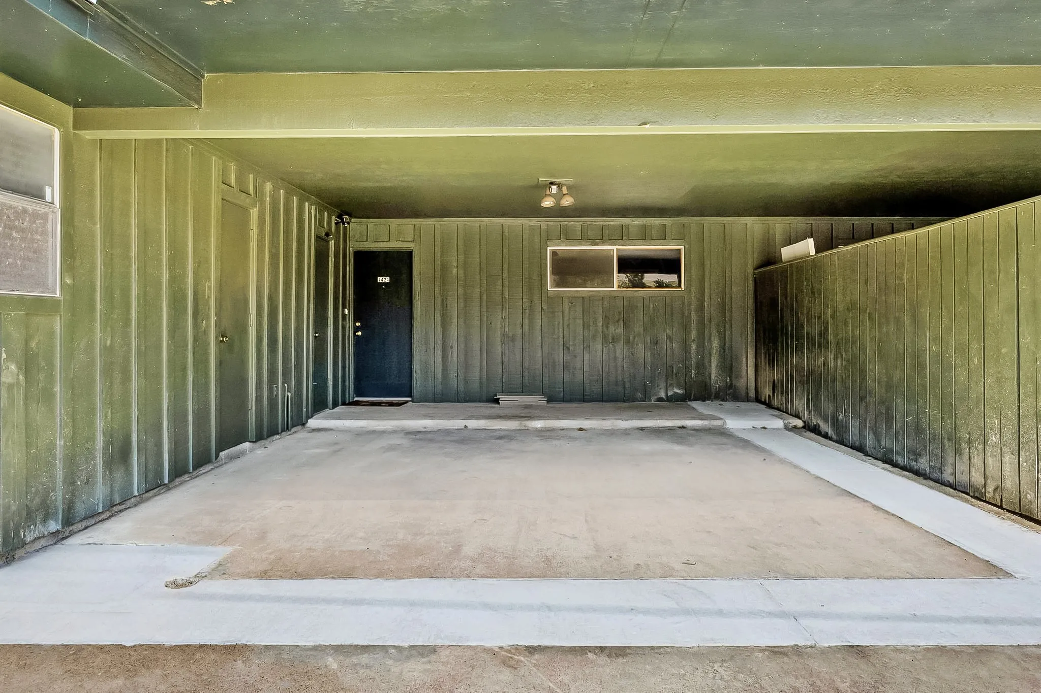 Covered carport providing convenient off-street parking and additional sheltered space.