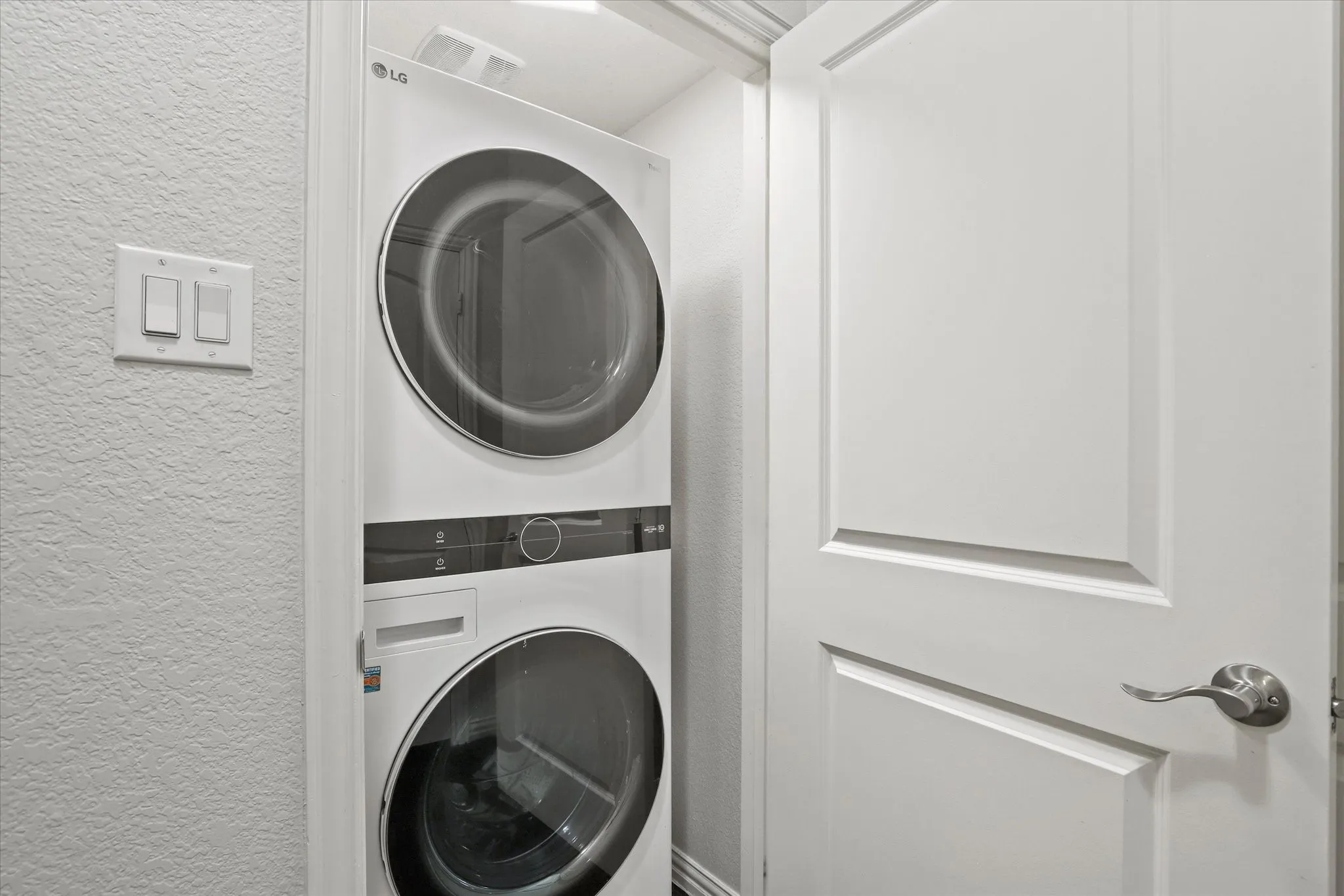 Stackable Washer and dryer come with the home.