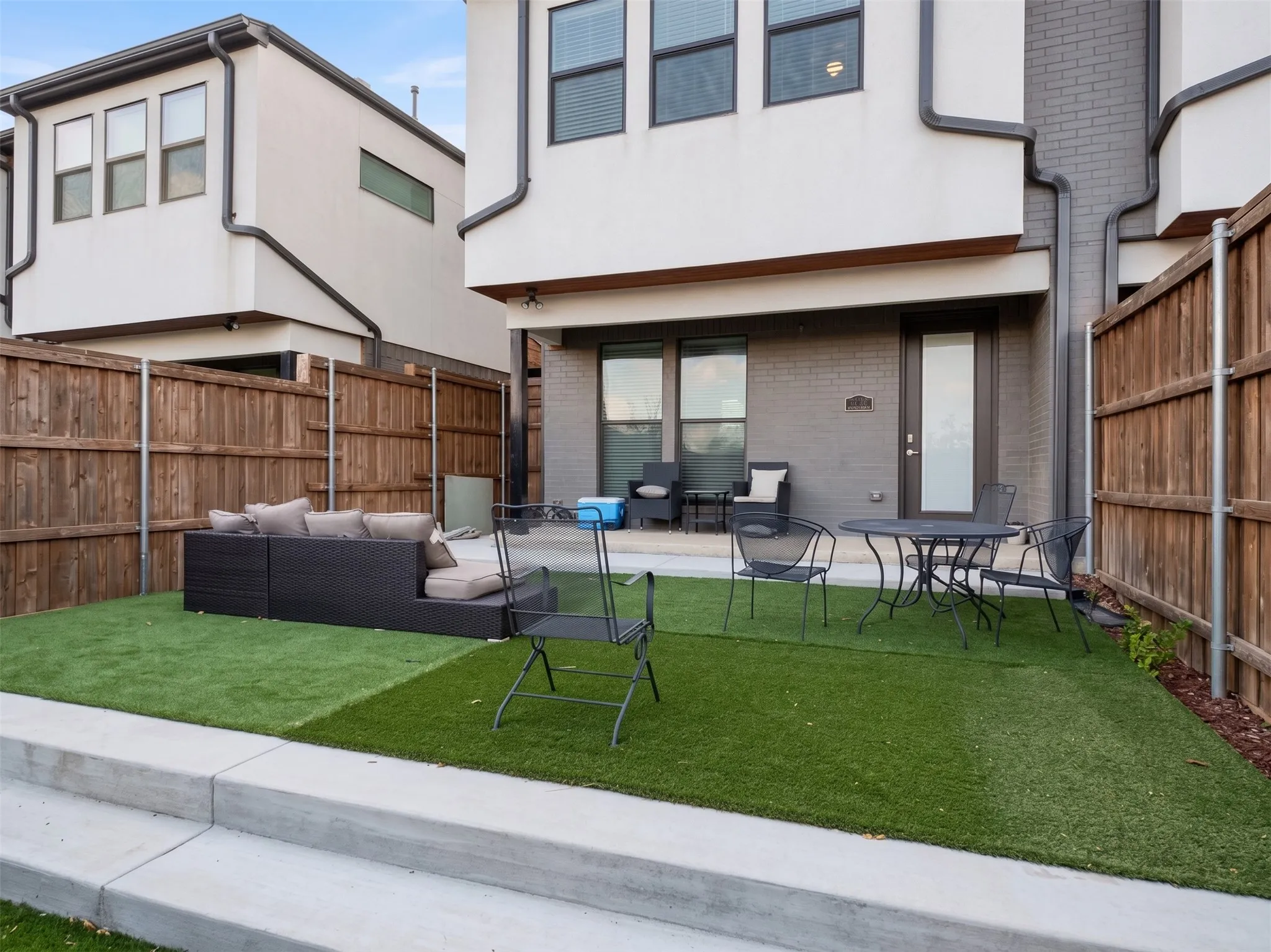 Private outdoor space with artificial turf