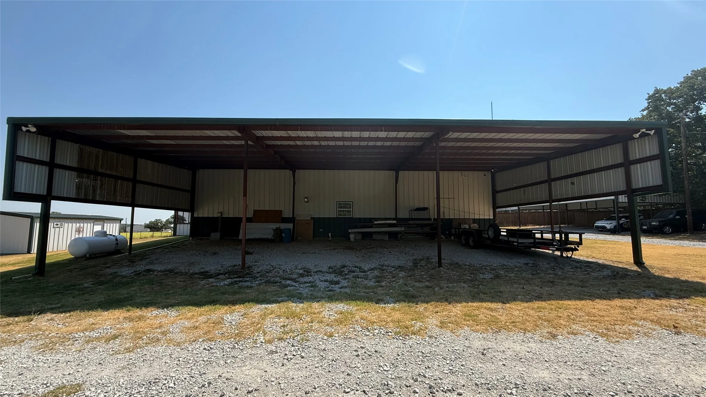Expansive covered structure with a metal roof and open sides
